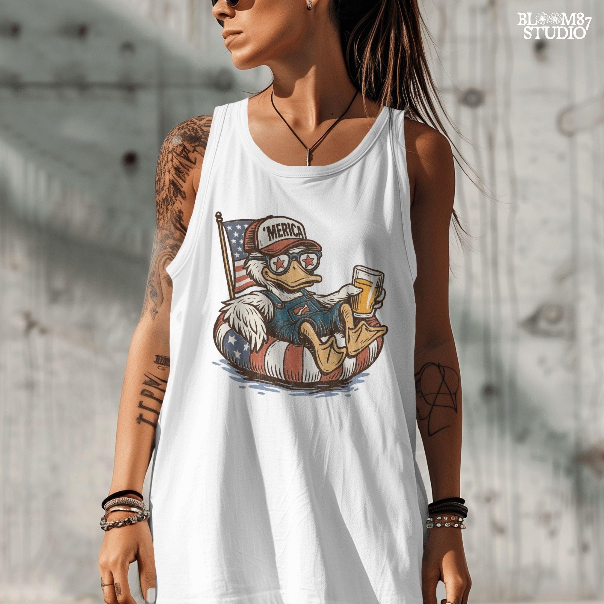 Cartoon duck lounging on a red, white, and blue floaty, wearing sunglasses and a ‘Merica cap, holding a beer with American flag background.