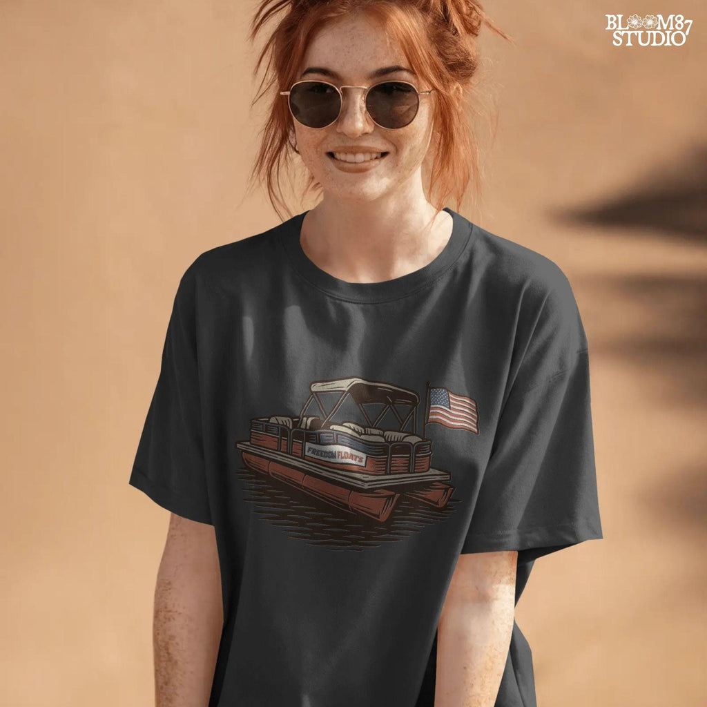 Vintage illustration of a red pontoon boat with “Freedom Floats” text and an American flag waving at the back, floating on a lake.