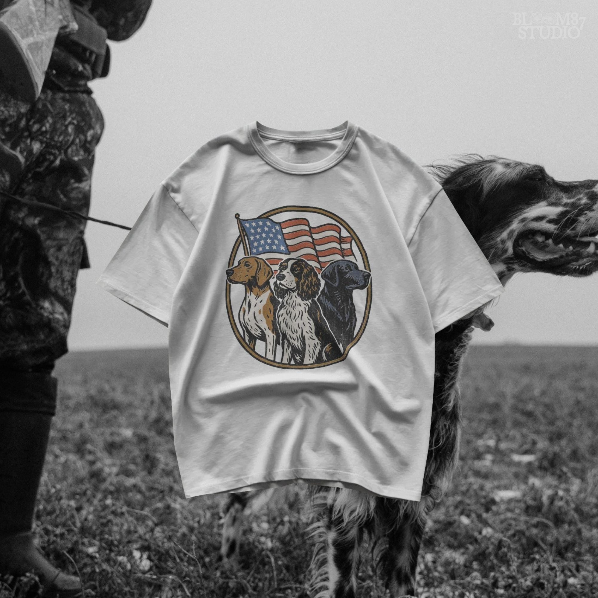 Illustration of three hunting dogs — Labrador, Spaniel, and Beagle — standing in front of a waving American flag, designed for patriotic dog lover sublimation projects.