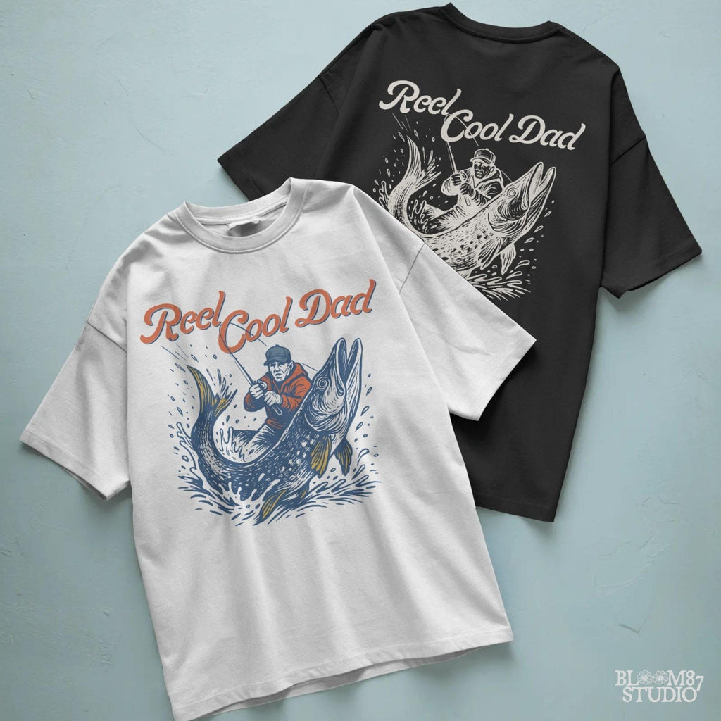 Illustration of a father reeling in a giant fish with bold text “Reel Cool Dad,” perfect for Father’s Day or fishing-themed gifts.
