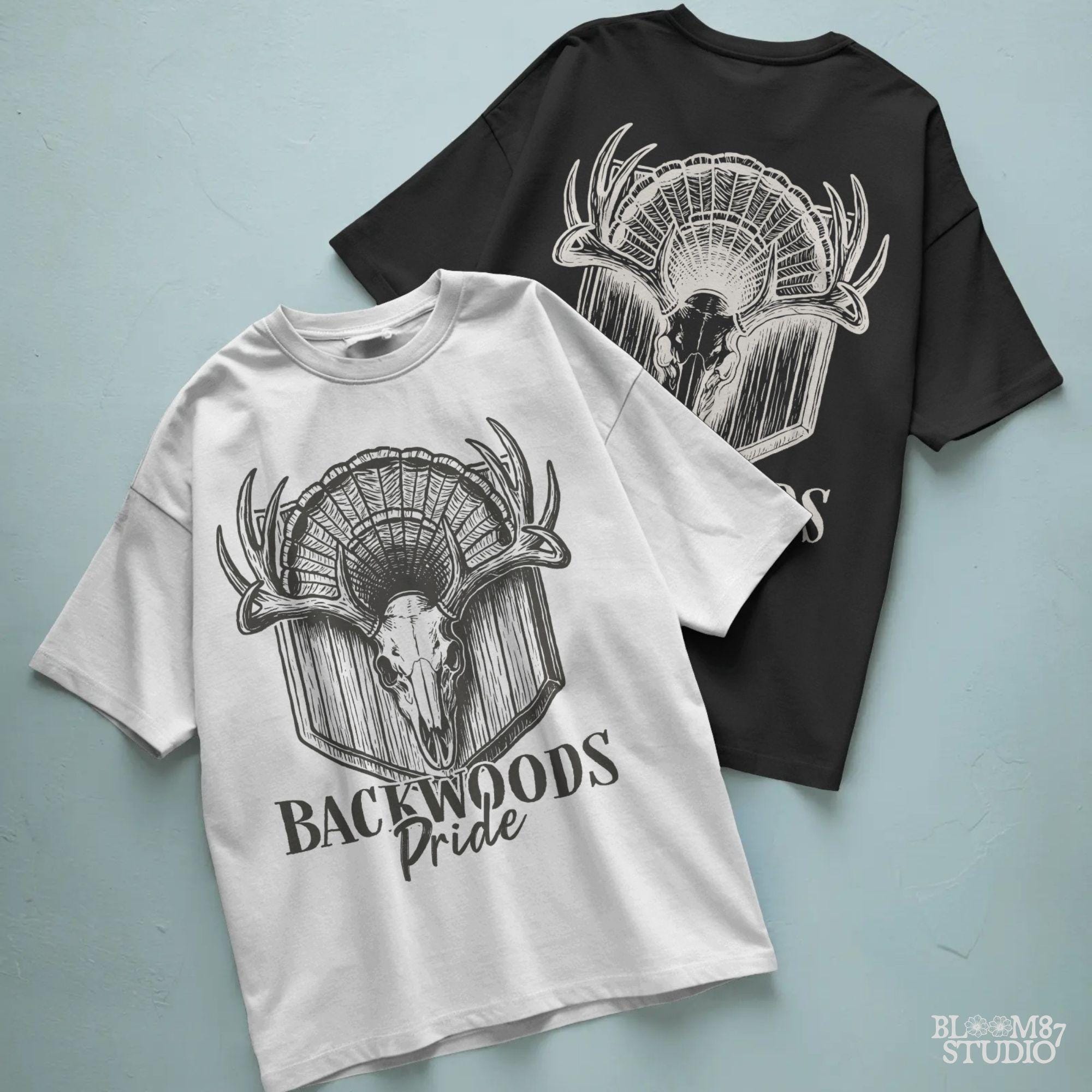 Rustic design of a deer skull with antlers and a turkey fan backdrop above the words “Backwoods Pride,” perfect for country and hunting themes.