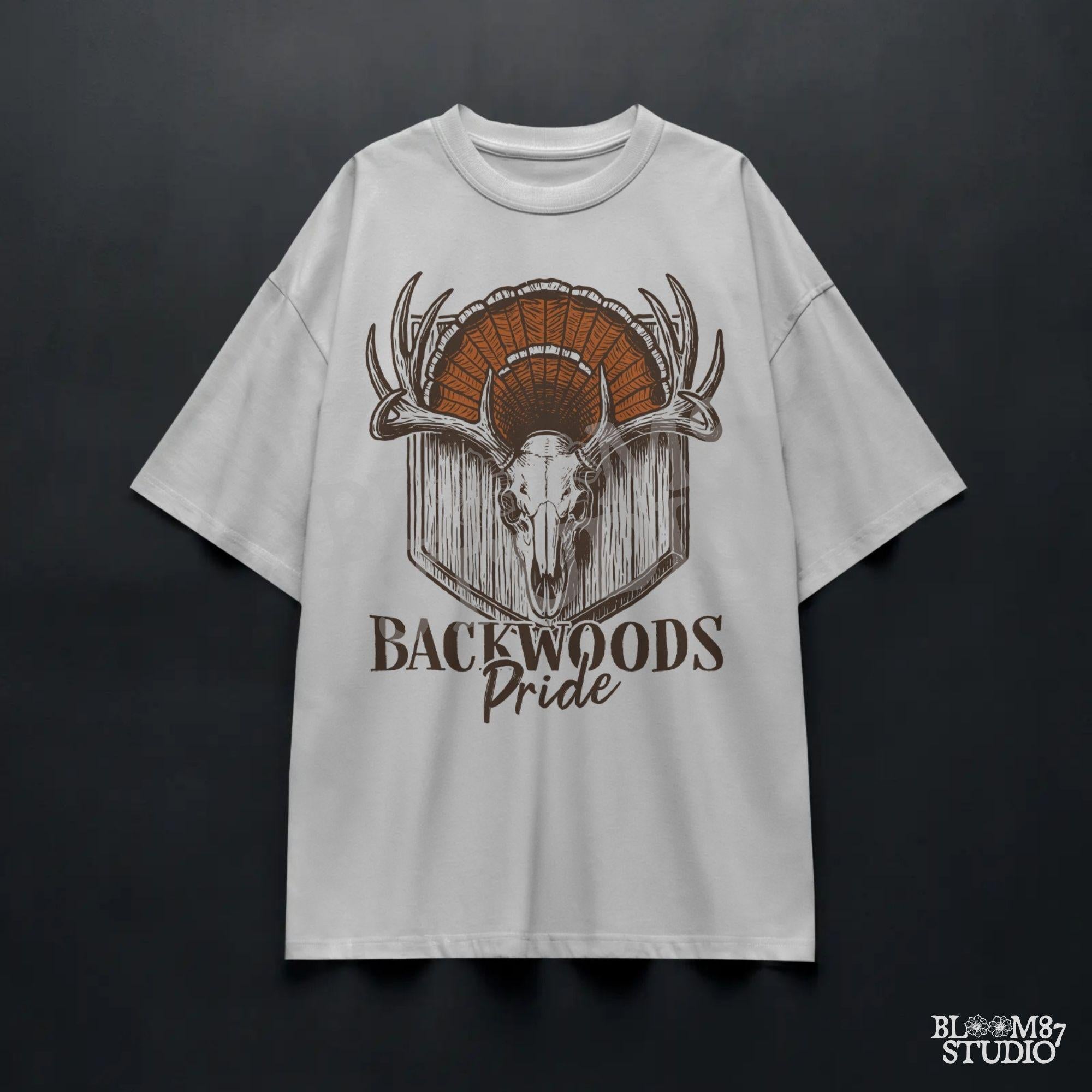 Rustic design of a deer skull with antlers and a turkey fan backdrop above the words “Backwoods Pride,” perfect for country and hunting themes.