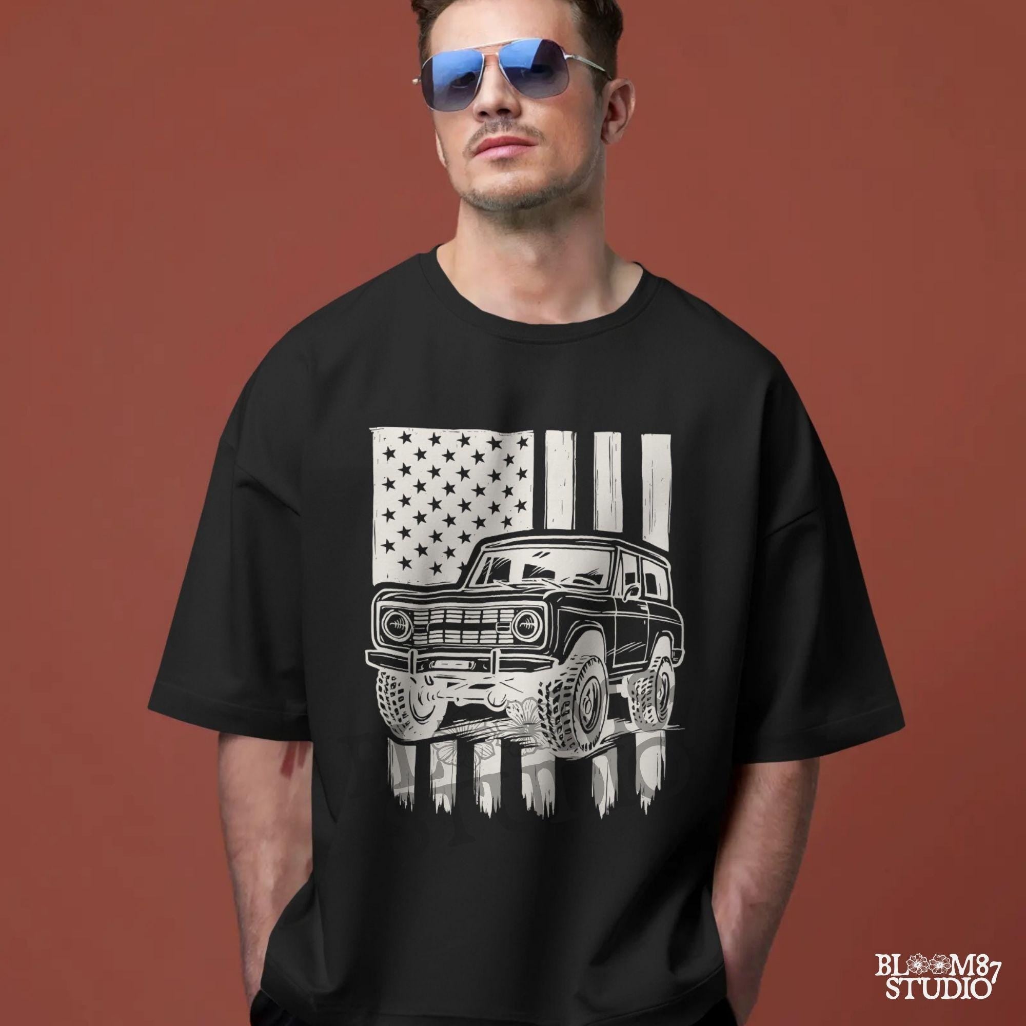 Vintage 4x4 Bronco-style off-road truck with bold tires over a distressed American flag, perfect for patriotic truck lovers and USA-themed designs.