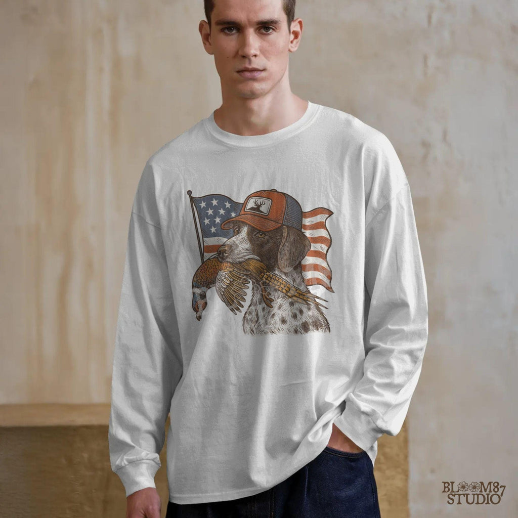 Hunting dog wearing a cap and holding a pheasant in its mouth, with a waving American flag in the background.