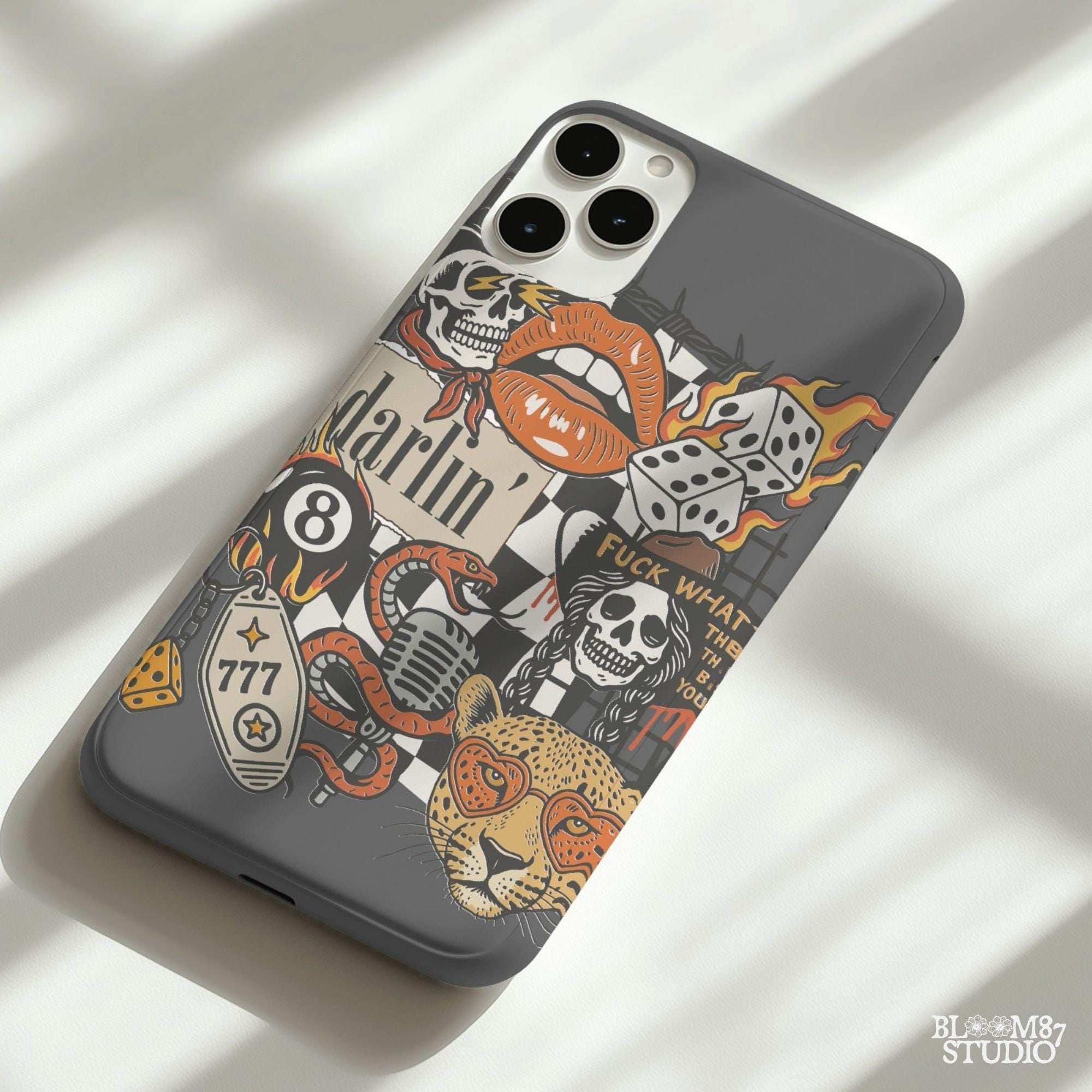 Western punk collage design featuring skulls, lips, leopard with heart glasses, snake and microphone, dice, barbed wire, and 777 tag.