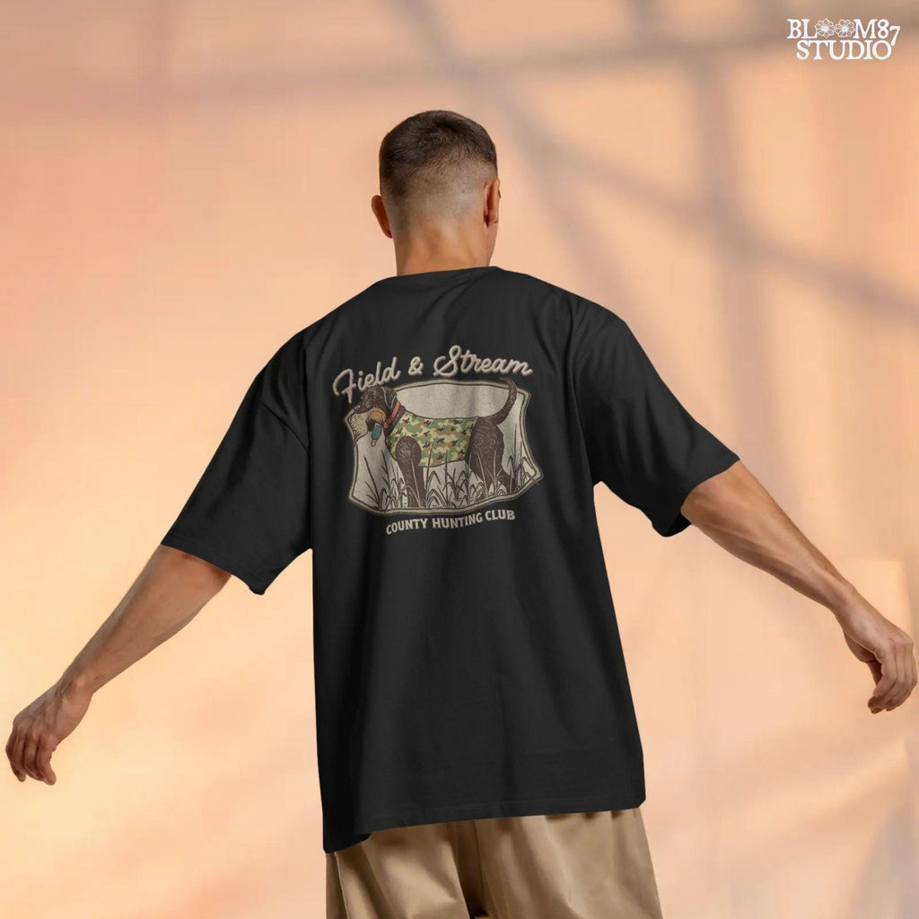 Vintage-style hunting club patch design featuring a black labrador in camo with a duck in its mouth, and the text “Field & Stream – County Hunting Club,” ideal for sublimation.