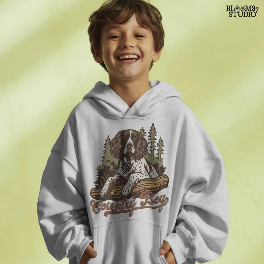 Illustration of a Springer Spaniel dog laying on a log in the woods with the words “Country Boy,” designed for rustic-themed sublimation and hunting dog lovers.