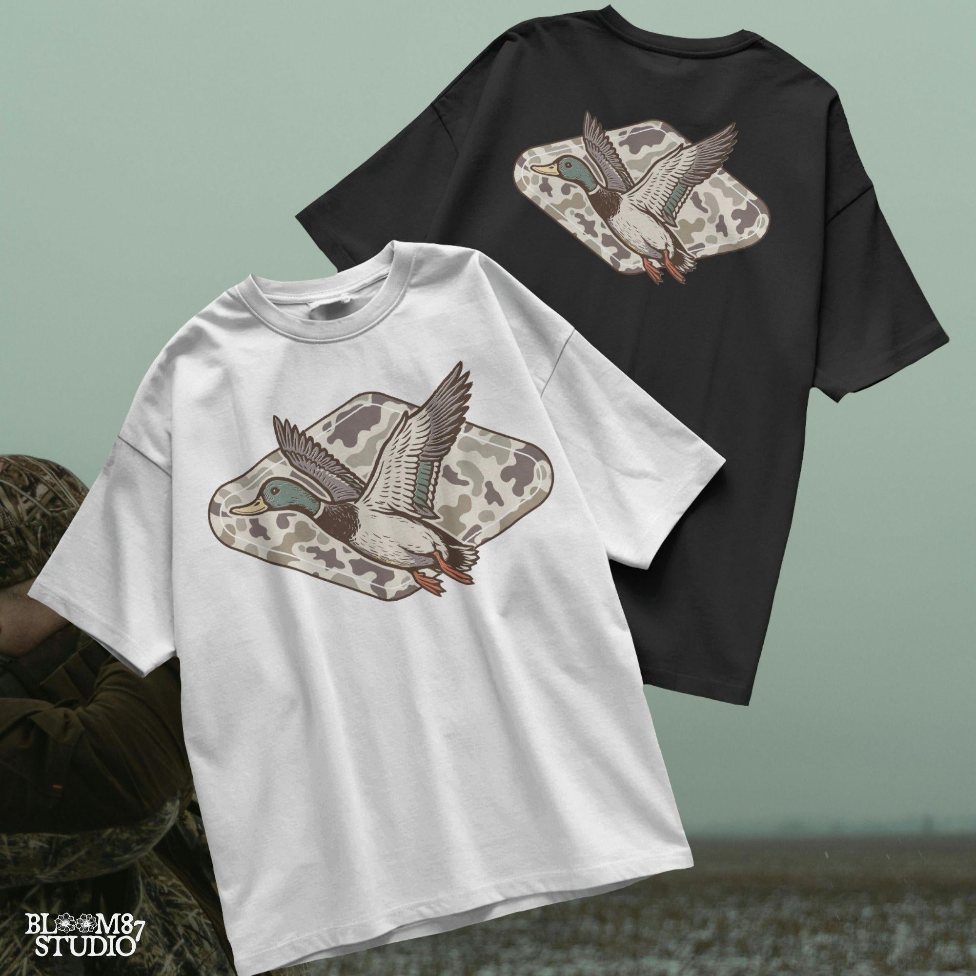 Flying mallard duck over old-school marsh camouflage background, designed in vintage hunting style for southern outdoorsman-themed crafts.