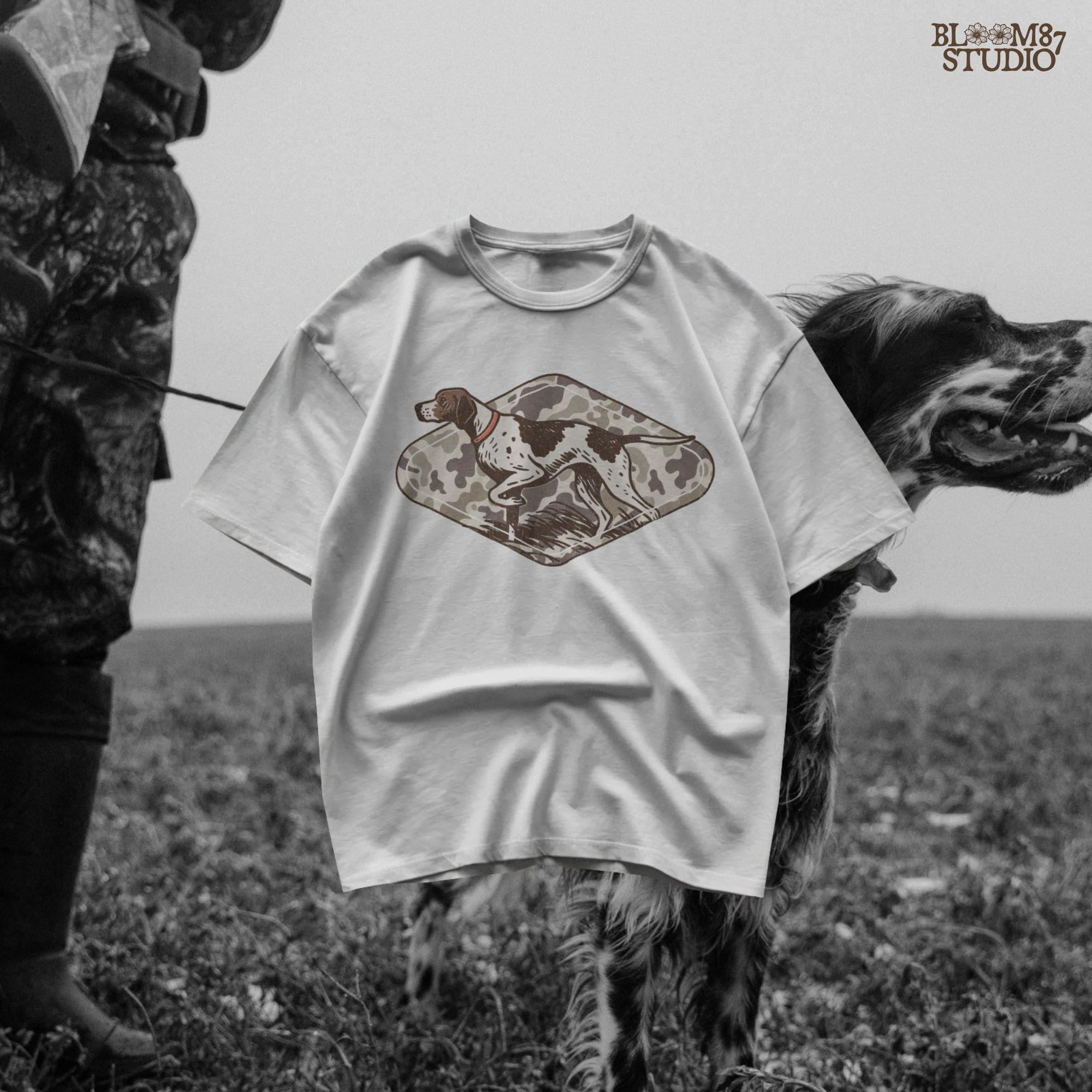 Illustration of a pointer hunting dog in a classic pointing stance on a vintage camo background, designed for upland hunting and outdoor-themed projects.