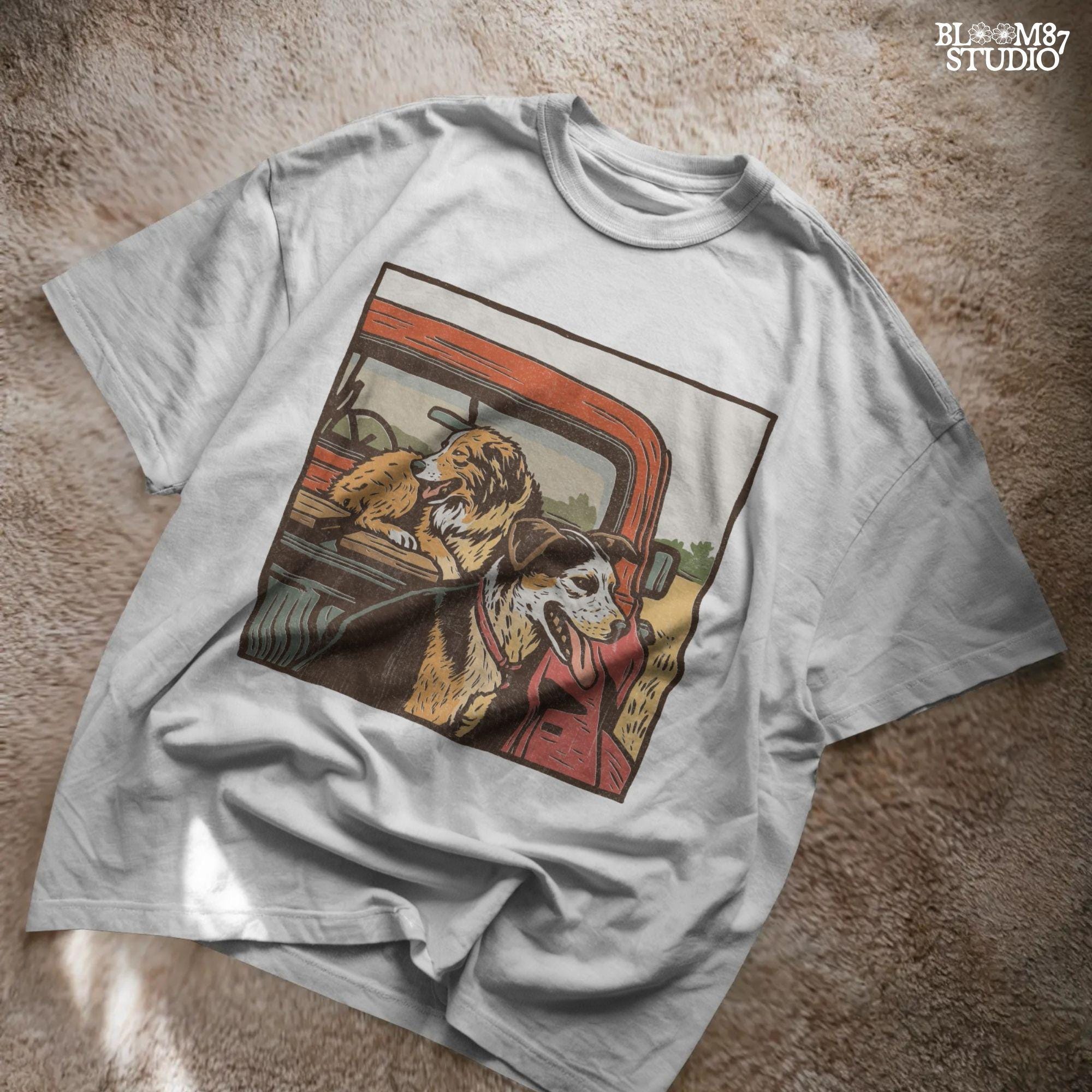 Vintage-style illustration of two dogs — an Australian Shepherd and a Cattle Dog — riding in the back of a red farm truck, designed for sublimation and rustic decor.