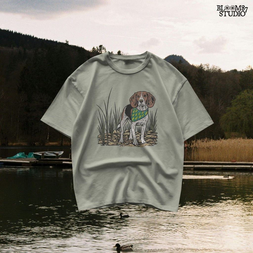 Hand-drawn beagle dog wearing a pineapple bandana, standing in a rocky grass field, designed for sublimation and pet lover gifts.