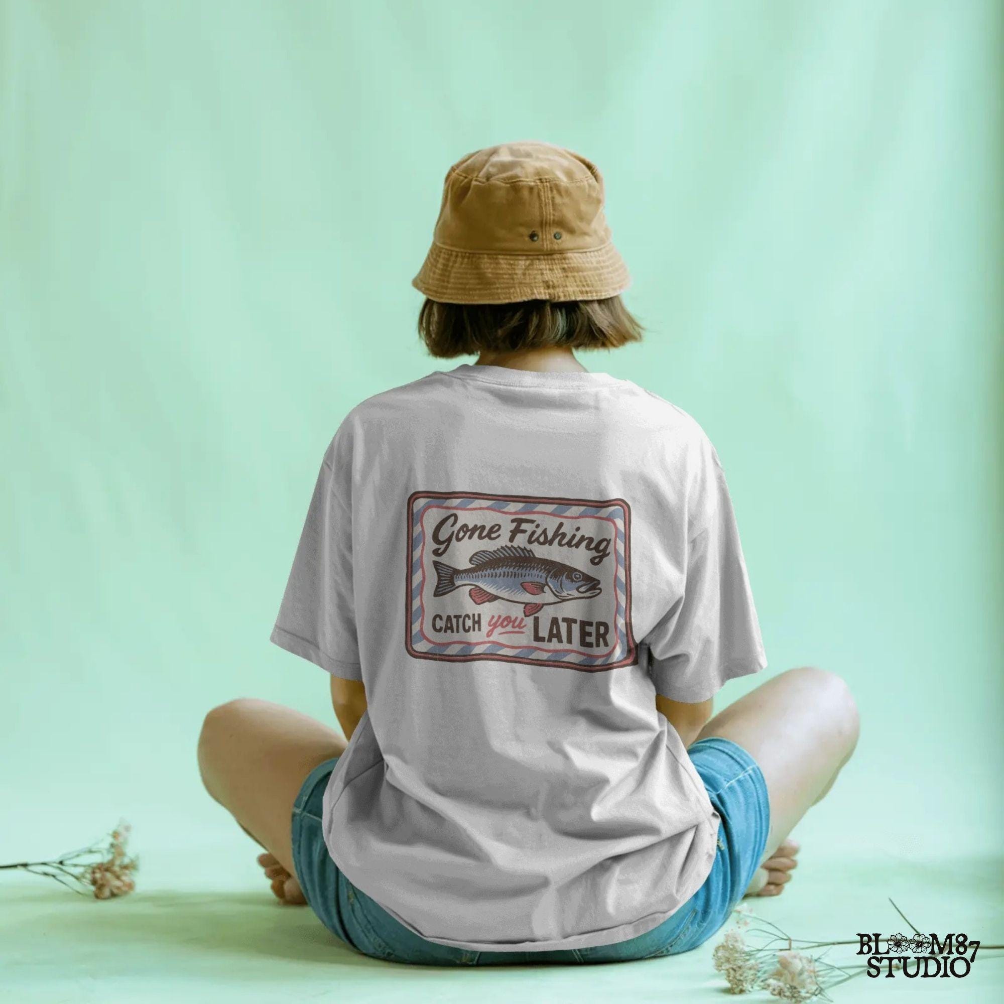 Vintage-style “Gone Fishing Catch You Later” sign with a bold blue and red fish illustration and striped border, ideal for fishing lovers.