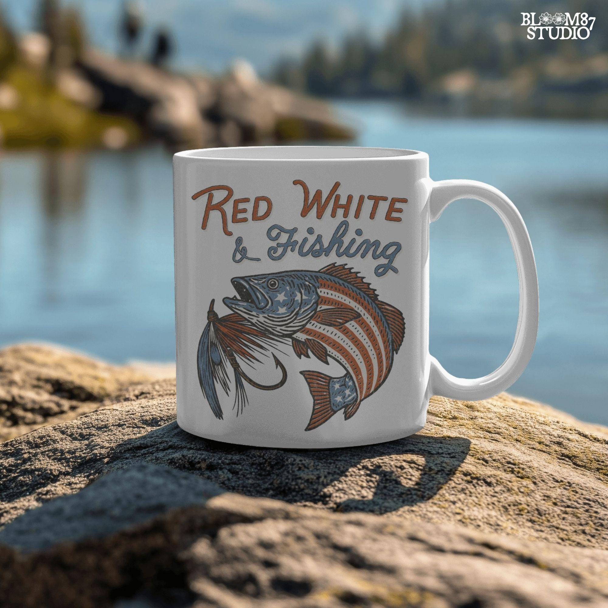 Bass fish decorated with American flag stars and stripes, jumping with a fishing lure and text “Red White & Fishing” in patriotic style.