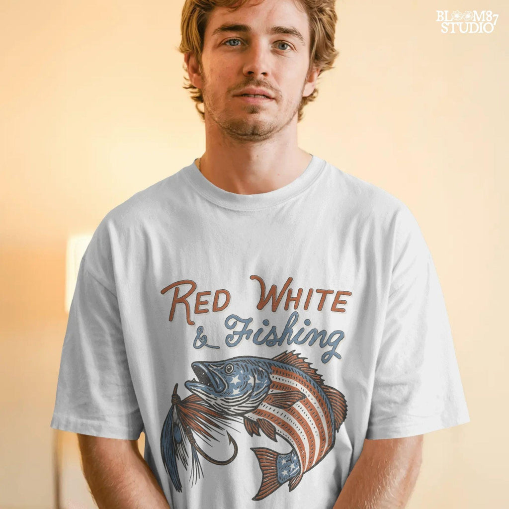 Bass fish decorated with American flag stars and stripes, jumping with a fishing lure and text “Red White & Fishing” in patriotic style.