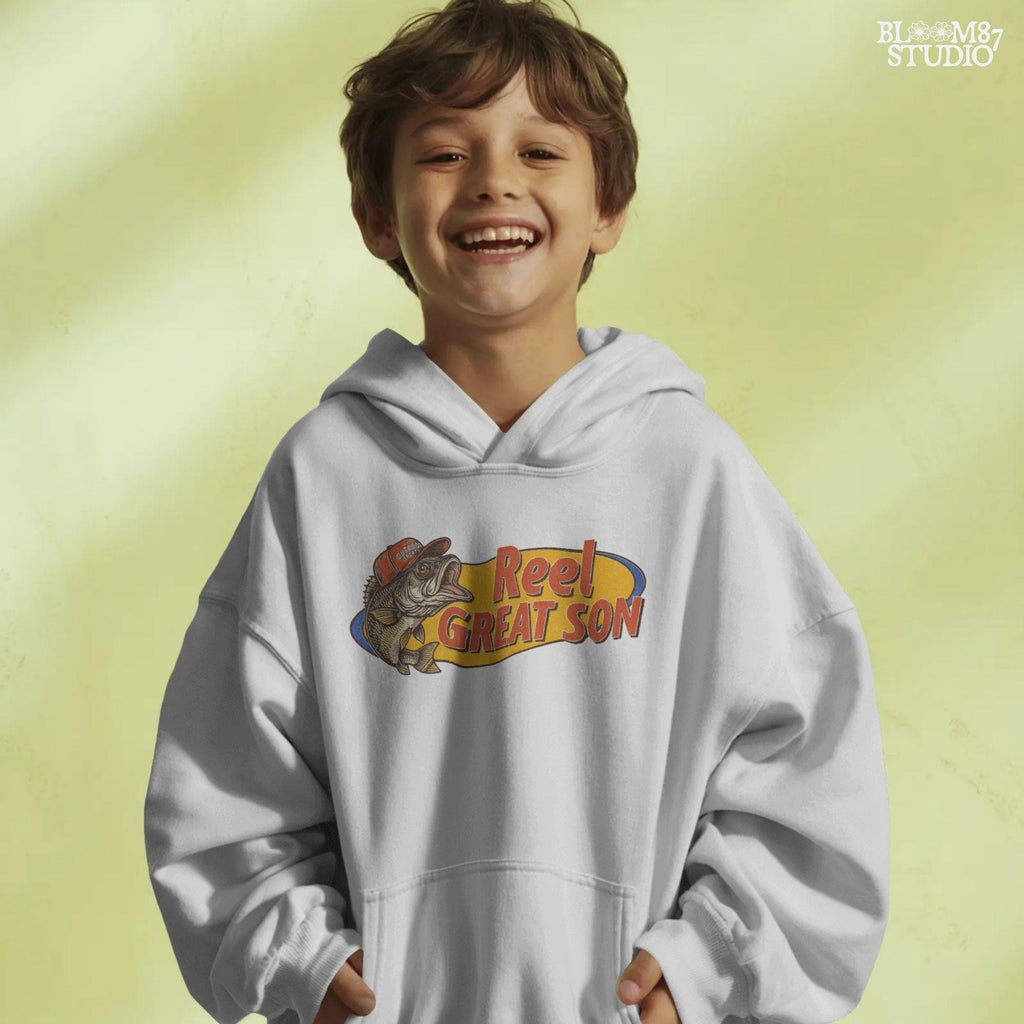 Illustration of a bass fish wearing a red trucker hat with the text “Reel Great Son” in bold vintage lettering, designed for sublimation and fishing-themed gifts for kids.