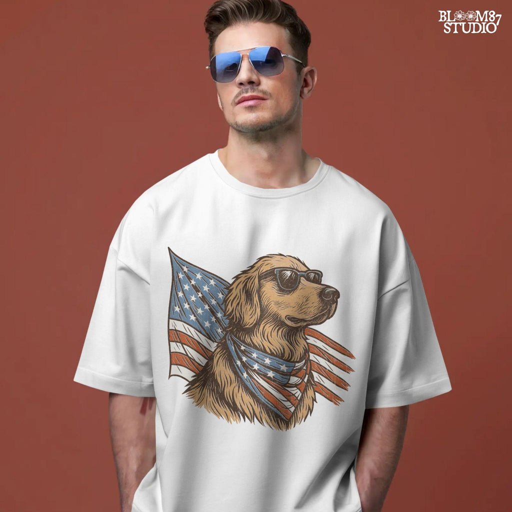 Golden retriever wearing sunglasses and American flag bandana with patriotic cape flowing behind in red, white, and blue design.