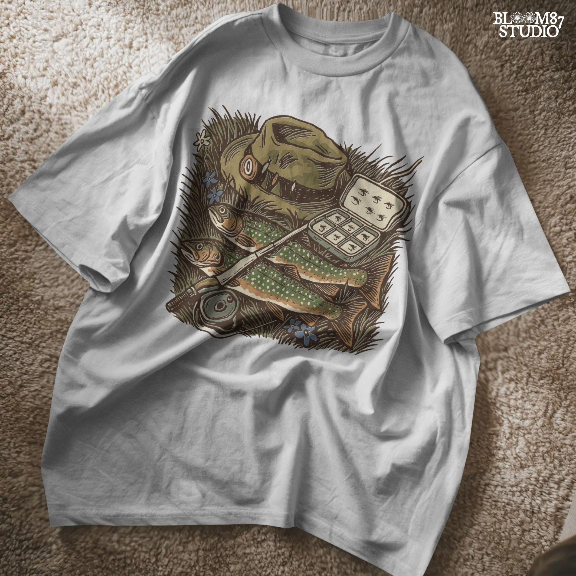 Vintage fly fishing illustration showing two trout, a fly rod, fisherman’s hat, and fly box on grassy ground with wildflowers.