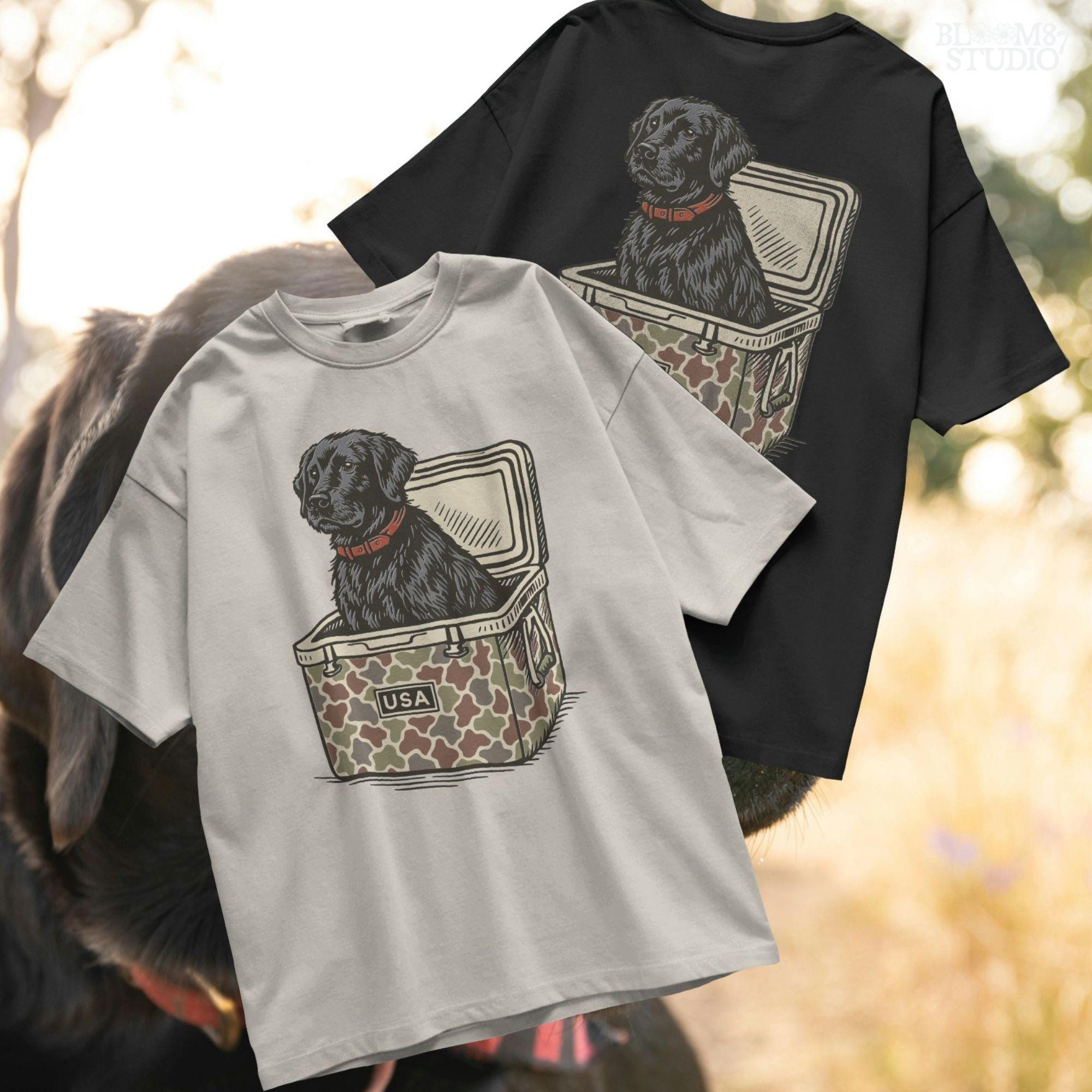 Hand-drawn black Labrador retriever sitting in a camouflage cooler labeled “USA,” designed for sublimation and hunting-themed merchandise.