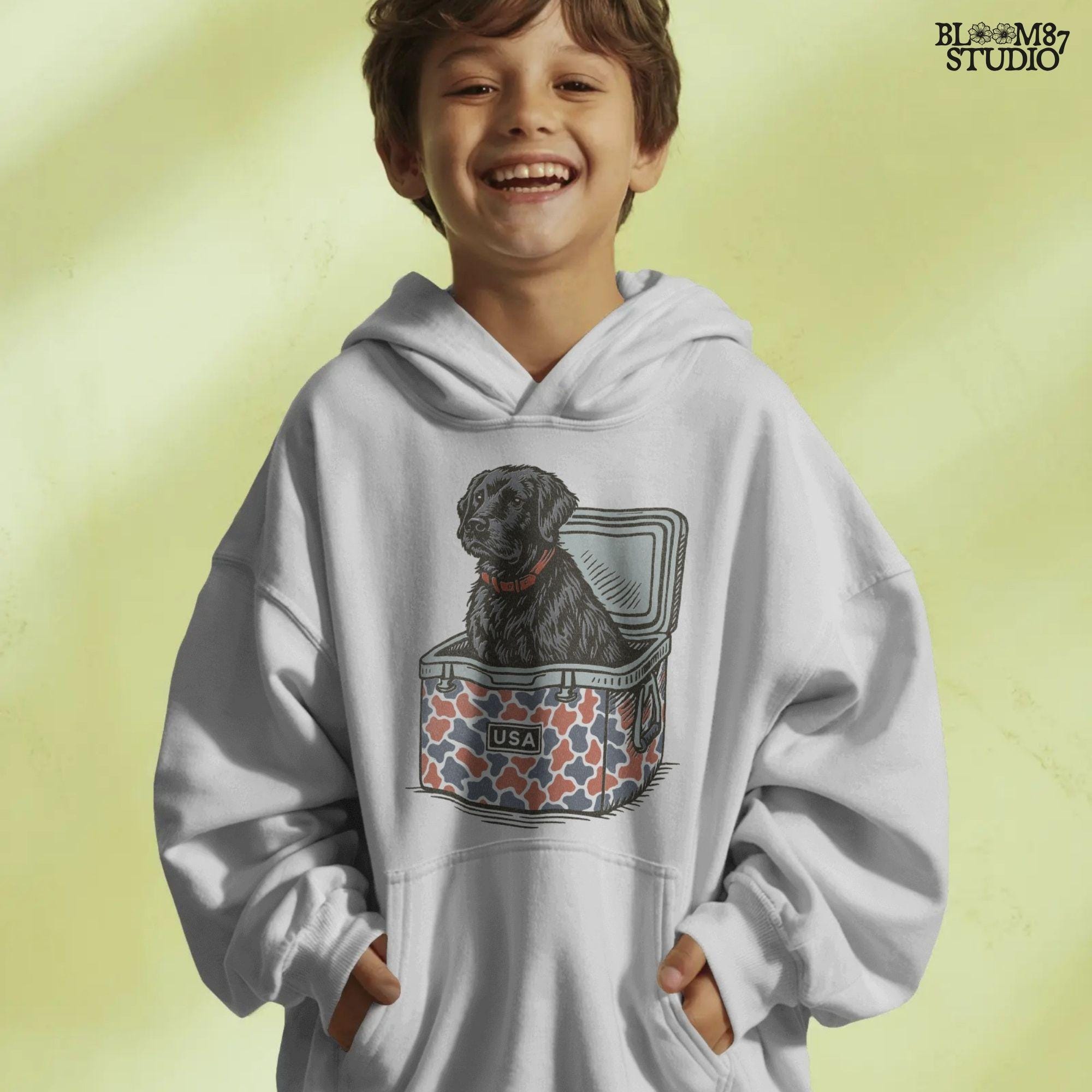 Illustration of a black Labrador retriever sitting in a red, white, and blue camo cooler with a “USA” label, designed for patriotic dog-themed sublimation.