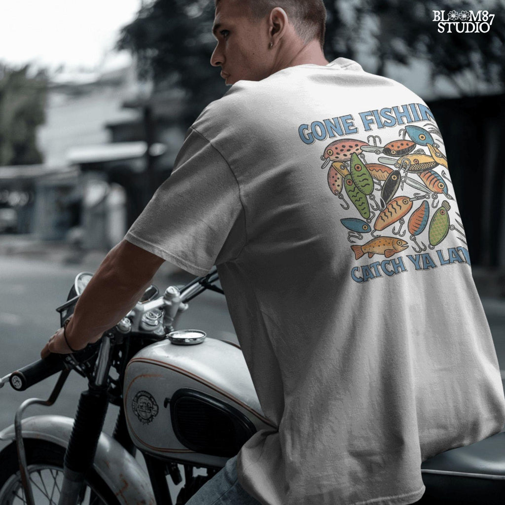 Vintage-style illustration of colorful fishing lures with the quote “Gone Fishin’ Catch Ya Later,” designed for sublimation and fisherman-themed projects.