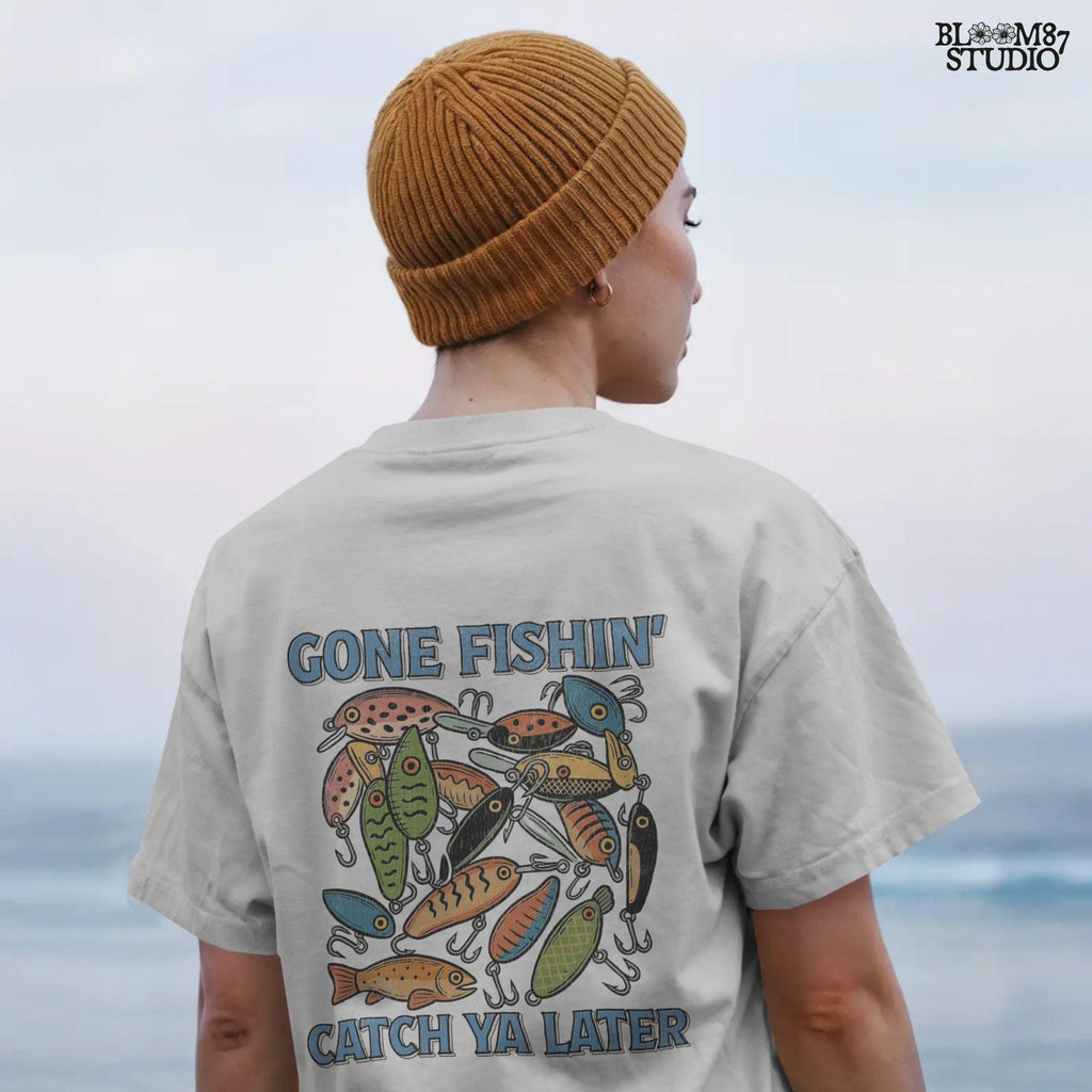 Vintage-style illustration of colorful fishing lures with the quote “Gone Fishin’ Catch Ya Later,” designed for sublimation and fisherman-themed projects.