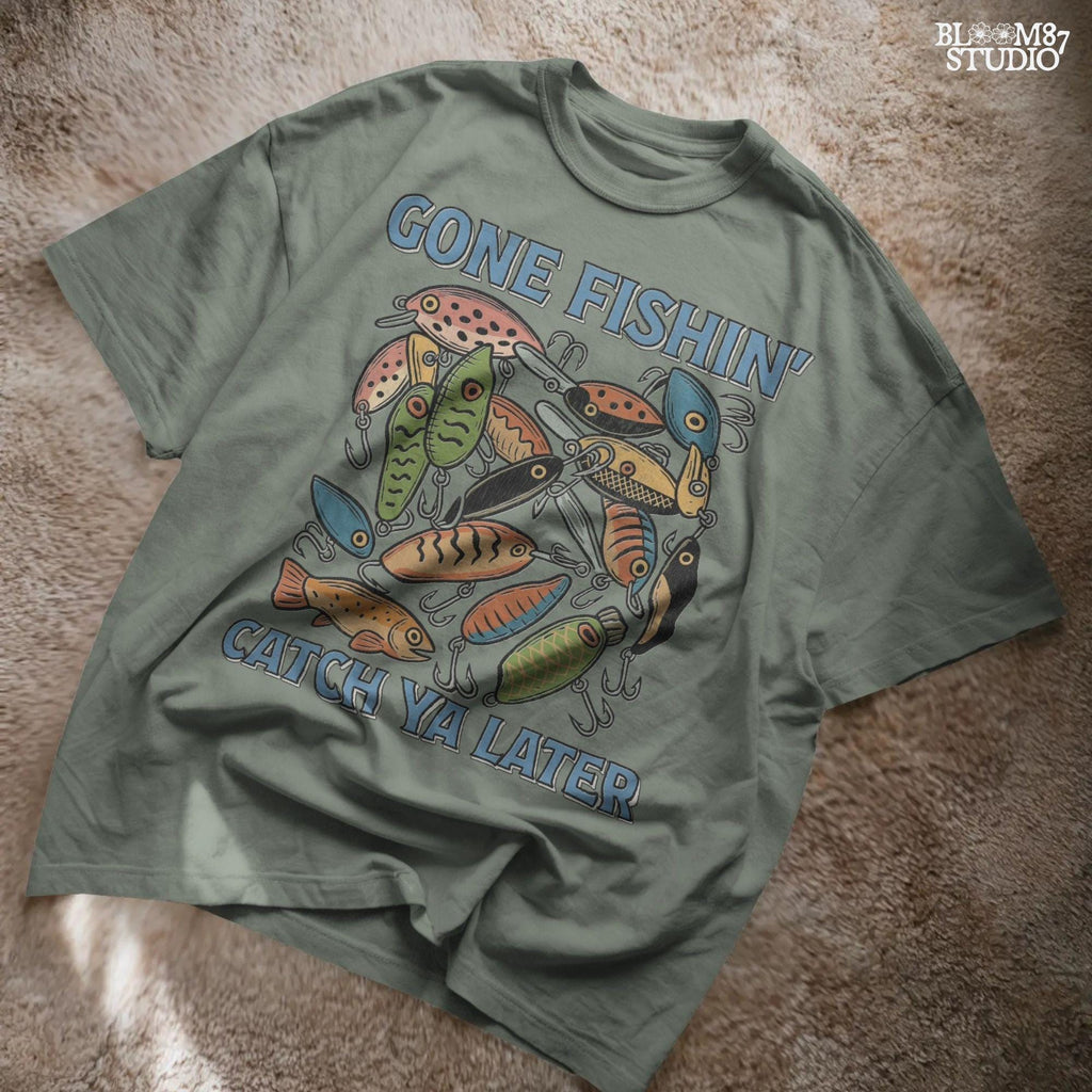 Vintage-style illustration of colorful fishing lures with the quote “Gone Fishin’ Catch Ya Later,” designed for sublimation and fisherman-themed projects.