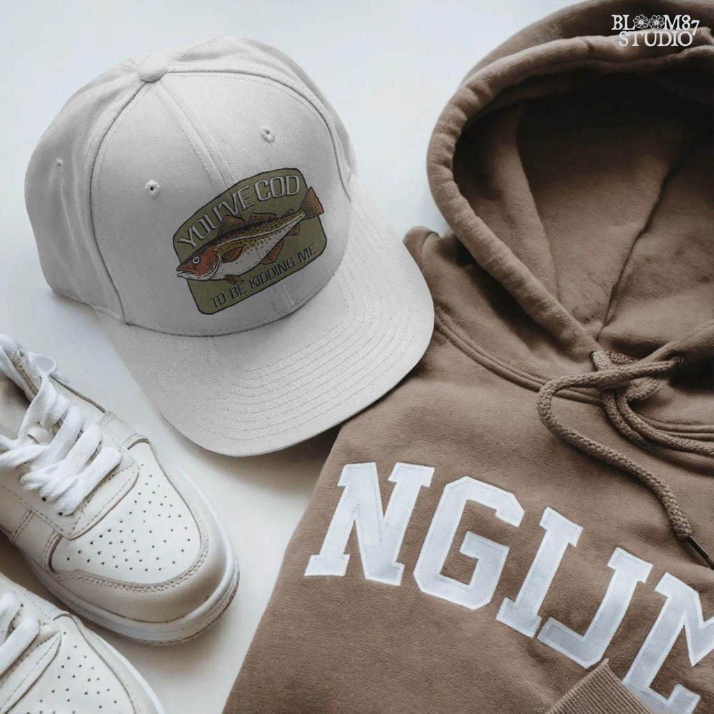 Hand-drawn Atlantic cod with the pun text “You’ve Cod to Be Kidding Me,” designed for funny fishing sublimation and dad joke gifts.