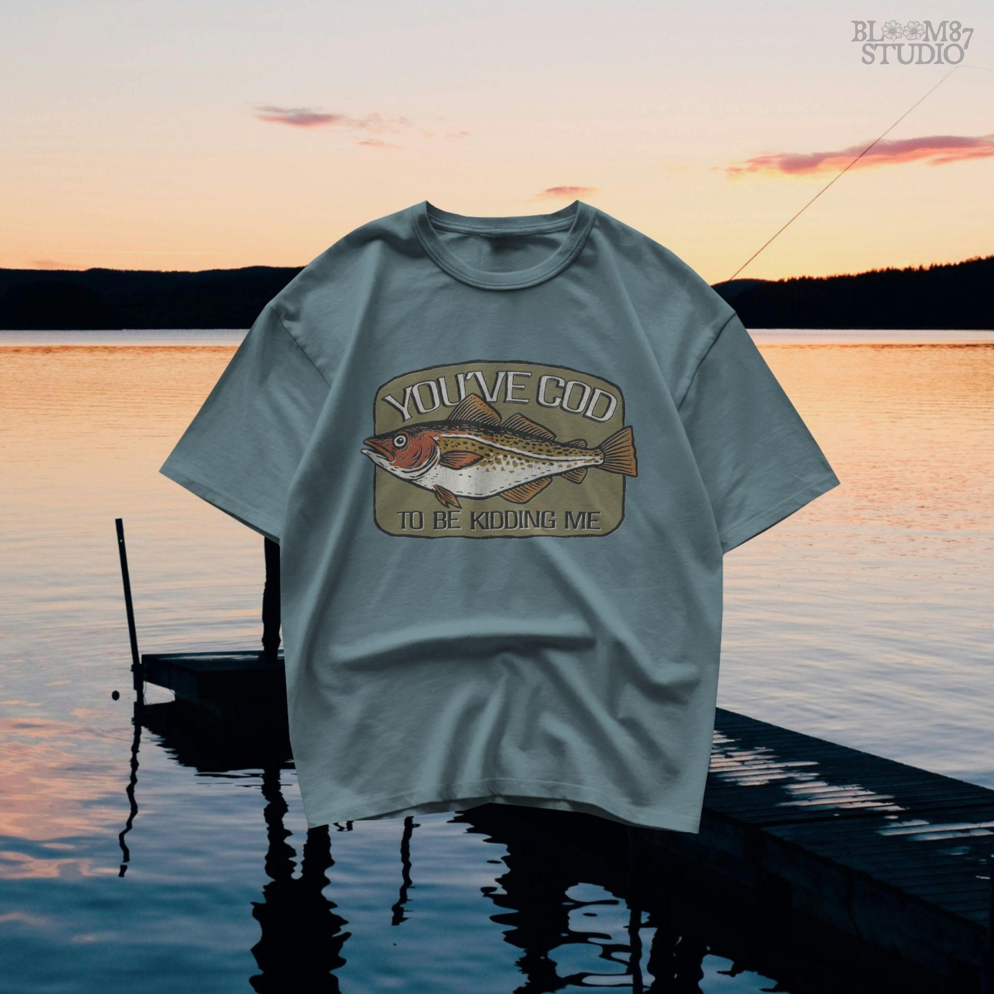 Hand-drawn Atlantic cod with the pun text “You’ve Cod to Be Kidding Me,” designed for funny fishing sublimation and dad joke gifts.