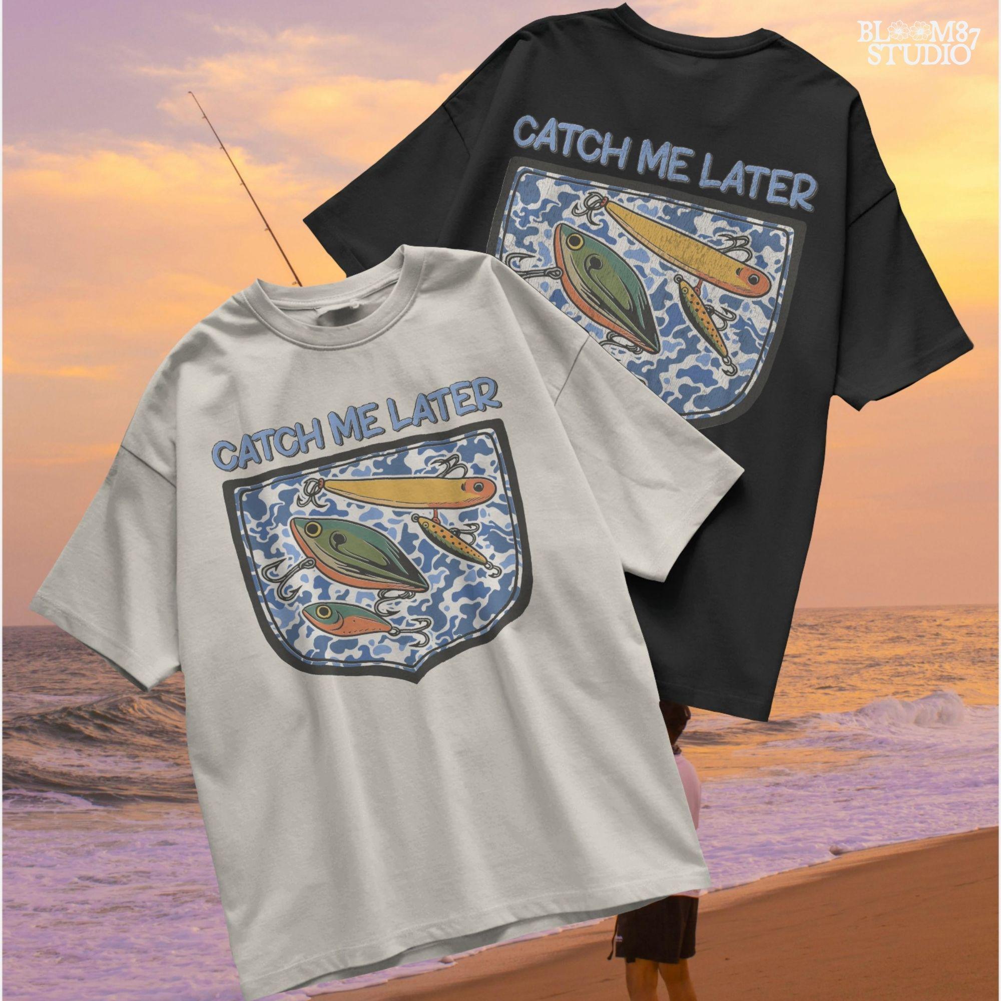 Funny “Catch Me Later” text above a faux blue camo pocket with colorful fishing lures, designed for sublimation printing on fisherman-themed apparel.