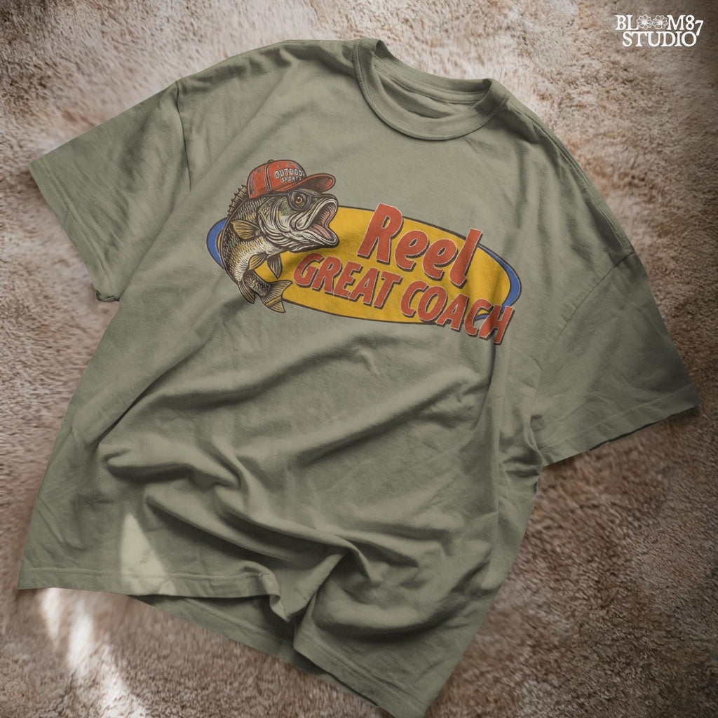 Vintage illustration of a largemouth bass wearing a red outdoor cap with the phrase “Reel Great Coach” in bold orange and yellow lettering, designed for sublimation on gifts and shirts.