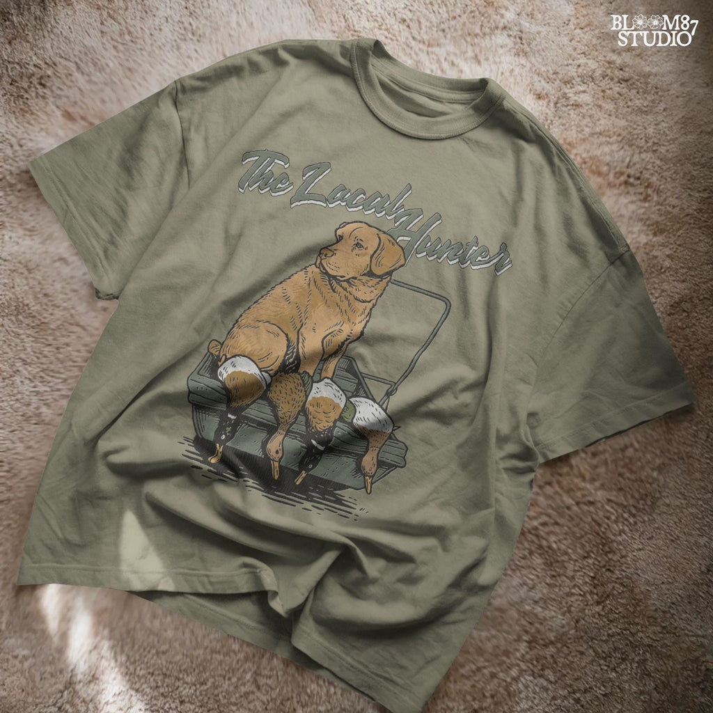 Vintage-style Labrador Retriever sitting in a duck boat with four mallards, text reads “The Local Hunter”, PNG for duck hunting apparel and sublimation.