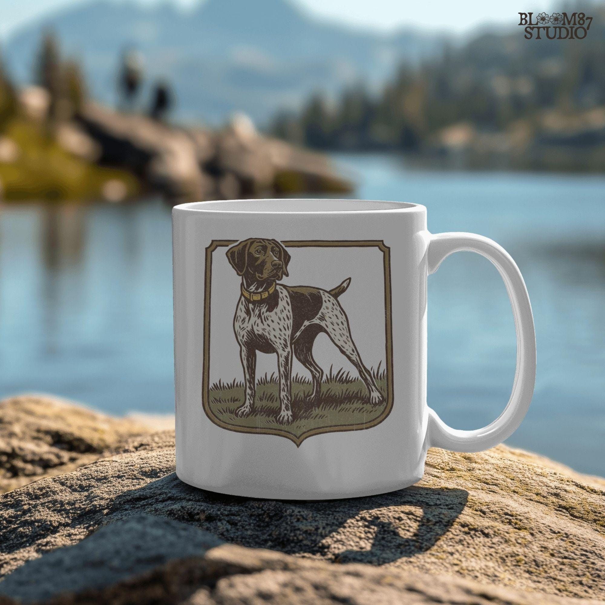 Vintage illustration of a German Shorthaired Pointer standing in grass with a framed border – rustic hunting dog PNG for sublimation.