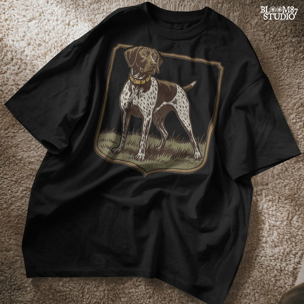Vintage illustration of a German Shorthaired Pointer standing in grass with a framed border – rustic hunting dog PNG for sublimation.
