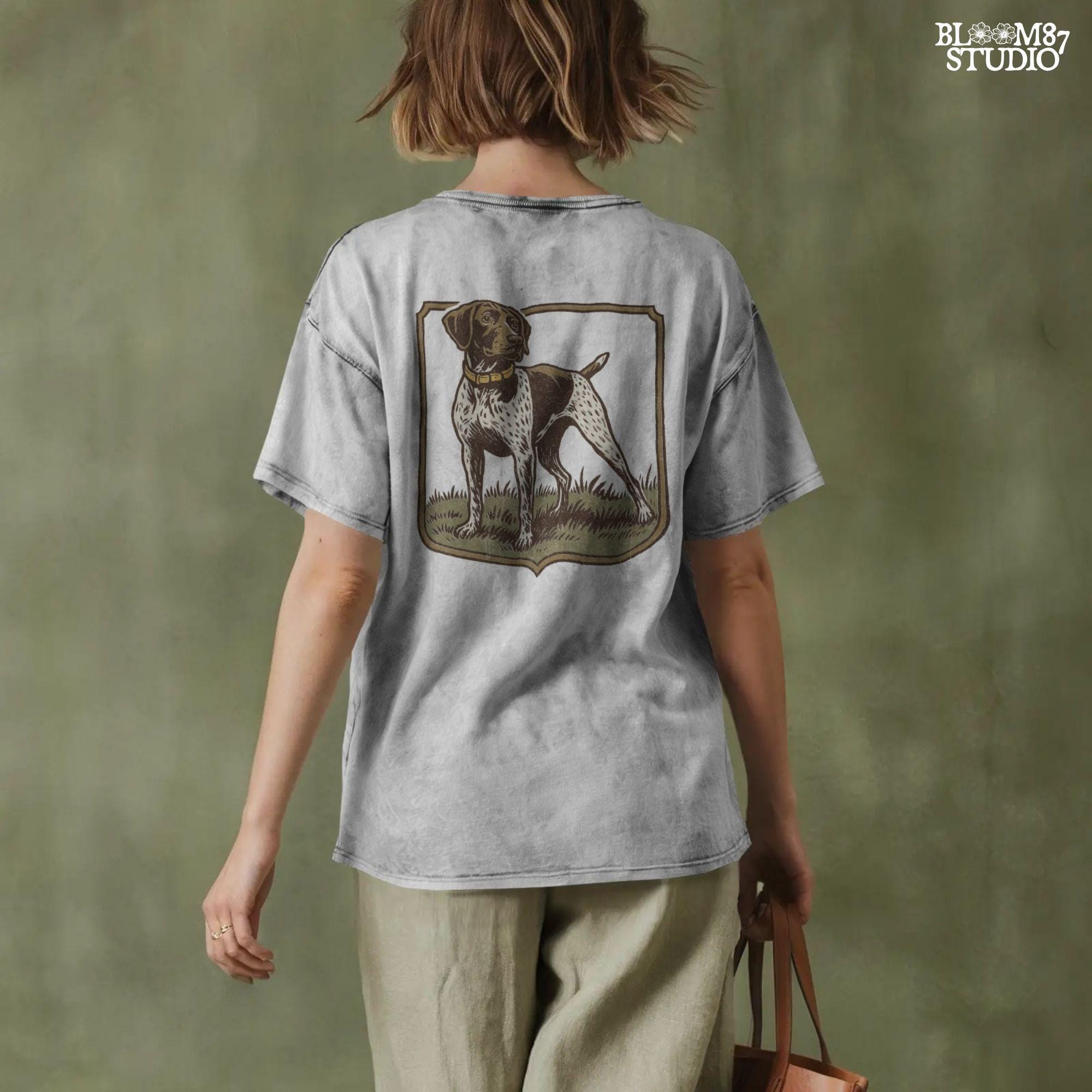 Vintage illustration of a German Shorthaired Pointer standing in grass with a framed border – rustic hunting dog PNG for sublimation.