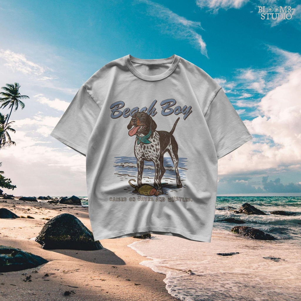 Vintage-style German Shorthaired Pointer standing on the beach with a buoy toy, text reads “Beach Boy – Raised on Waves and Whistles” – summer dog PNG.