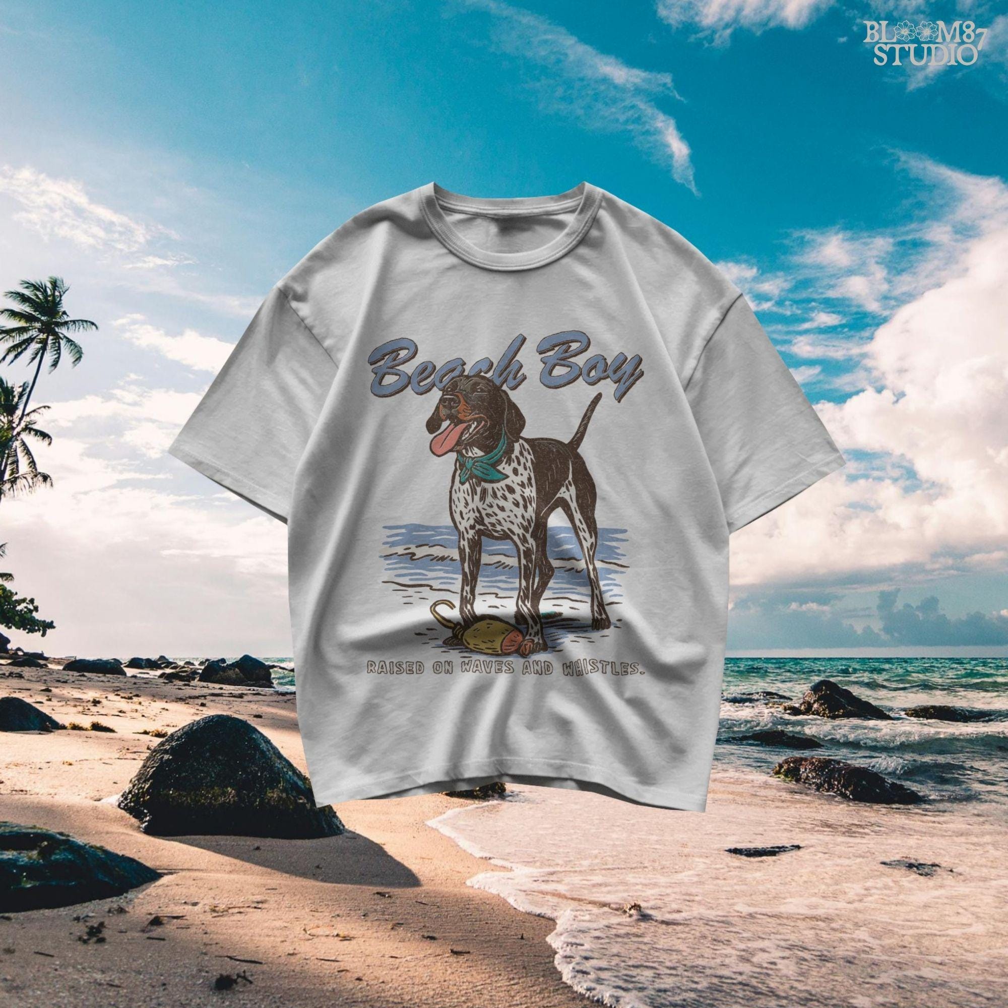 Vintage-style German Shorthaired Pointer standing on the beach with a buoy toy, text reads “Beach Boy – Raised on Waves and Whistles” – summer dog PNG.