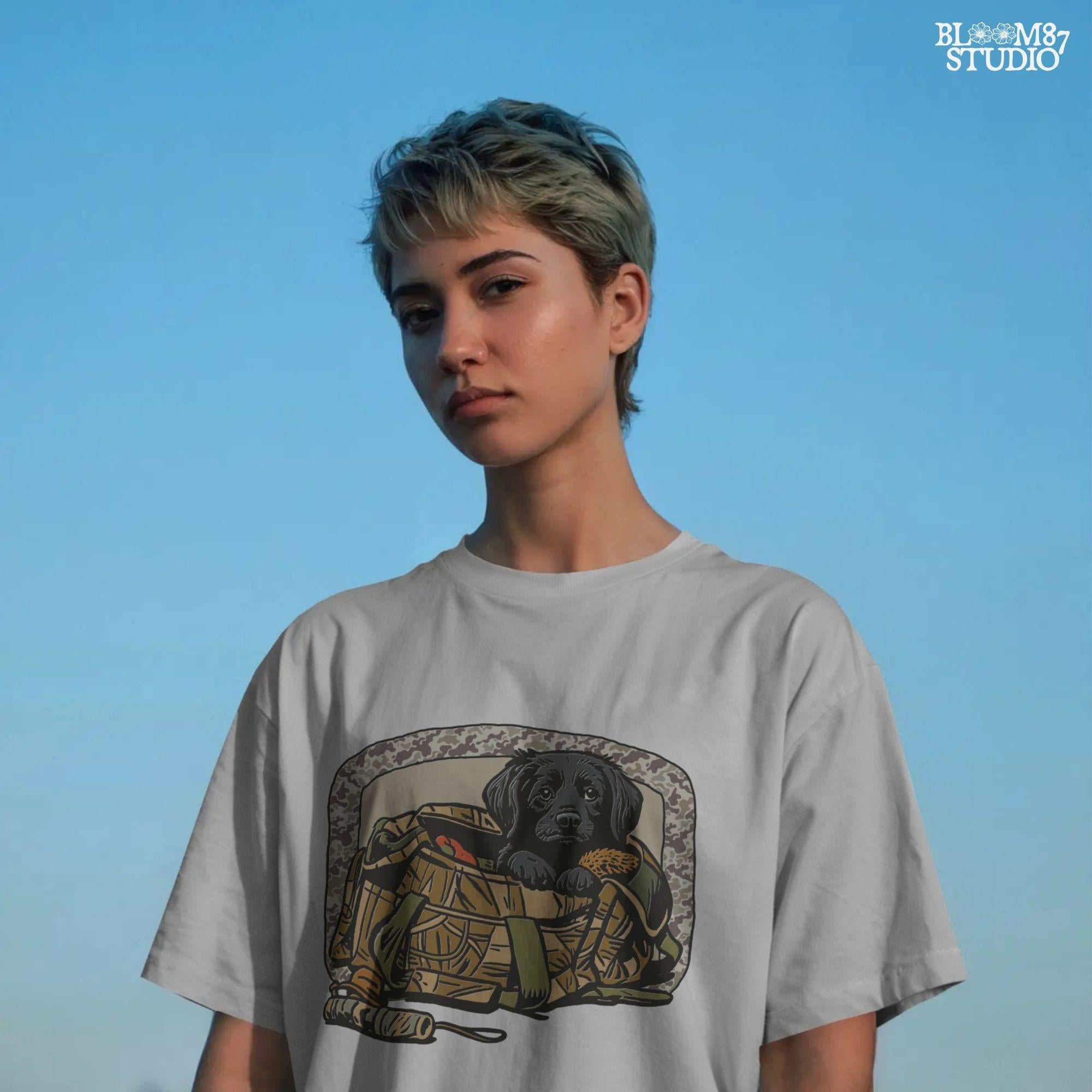 Black Labrador puppy in a camo hunting bag, framed in camouflage pattern, ideal for waterfowl and duck hunting sublimation art.