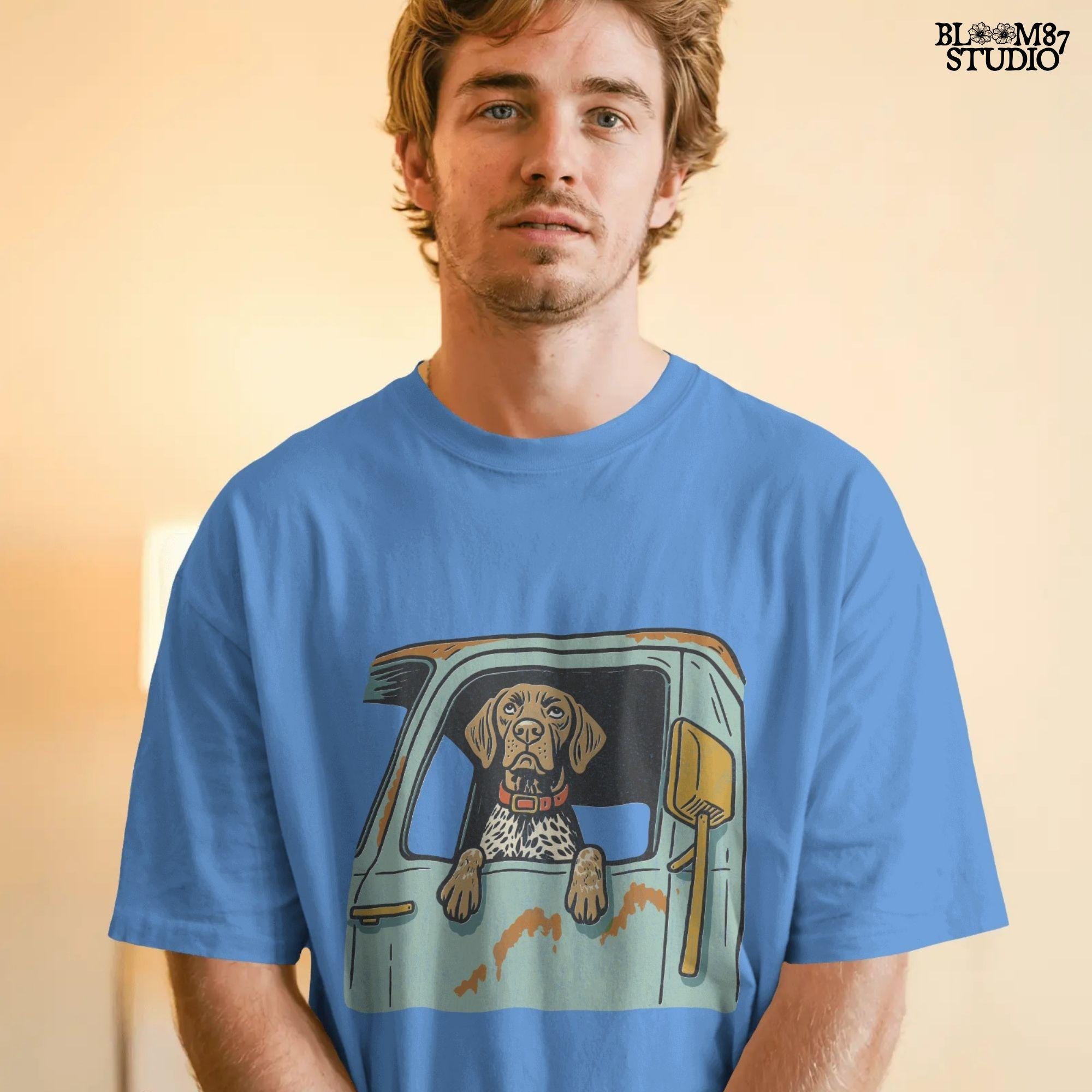 Vintage-style German Shorthaired Pointer with front paws out an old farm truck window – rustic hunting dog sublimation PNG.