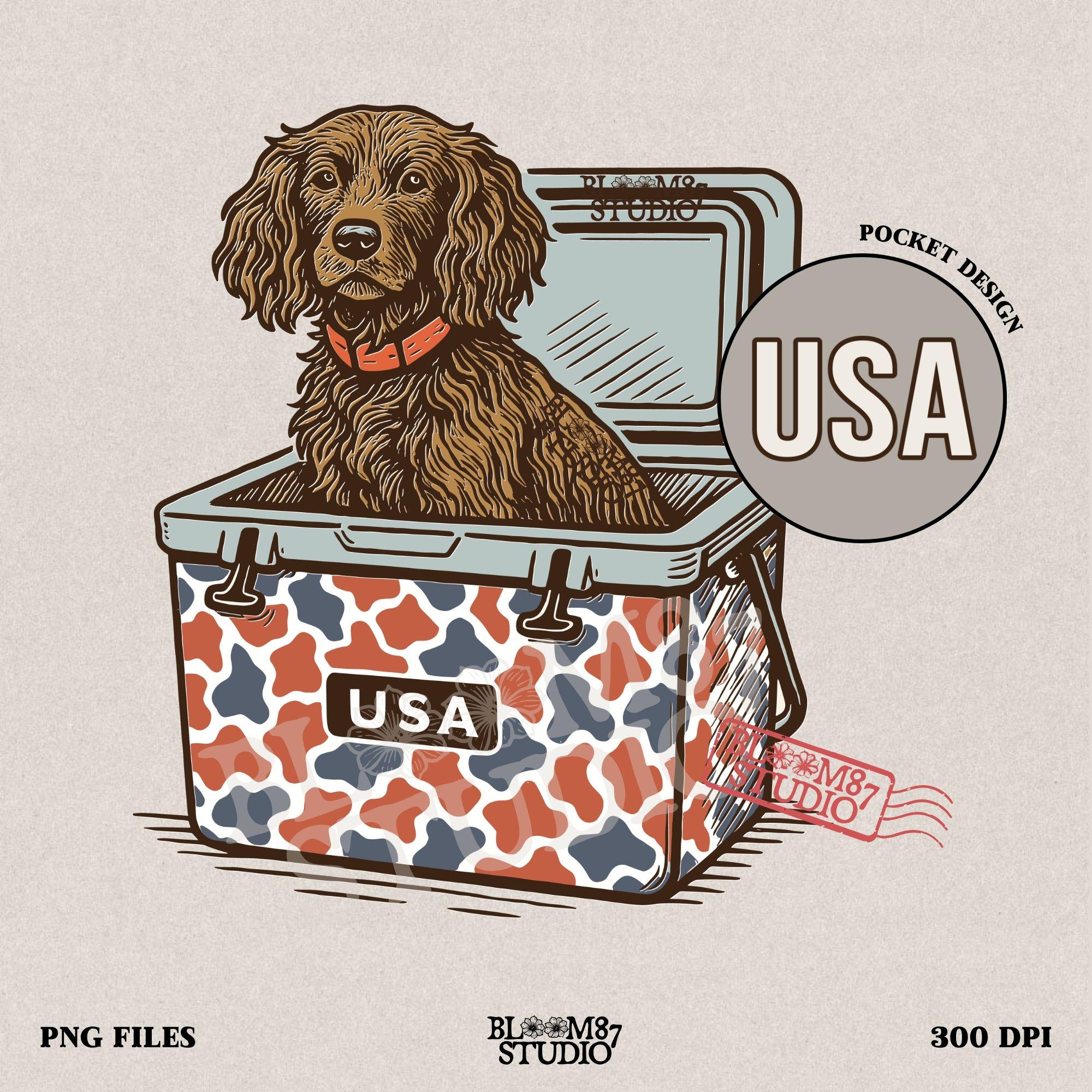 Sporting dog (spaniel type) sitting in a patriotic red-white-blue camo cooler labeled “USA” – sublimation PNG for southern dog lovers and summer crafts.