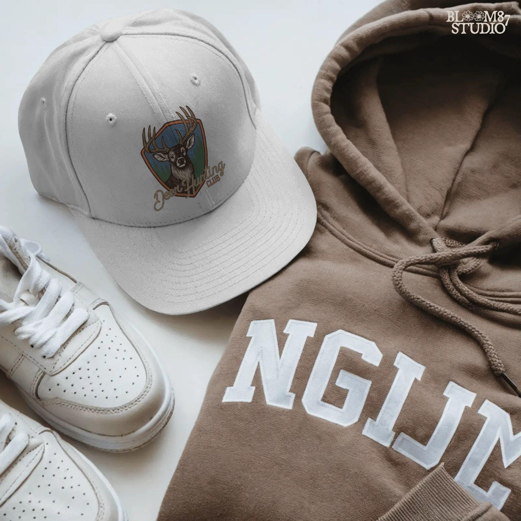 A rustic “Deer Hunting Club” badge with a bold whitetail buck and forest background, styled as a vintage hunting patch.