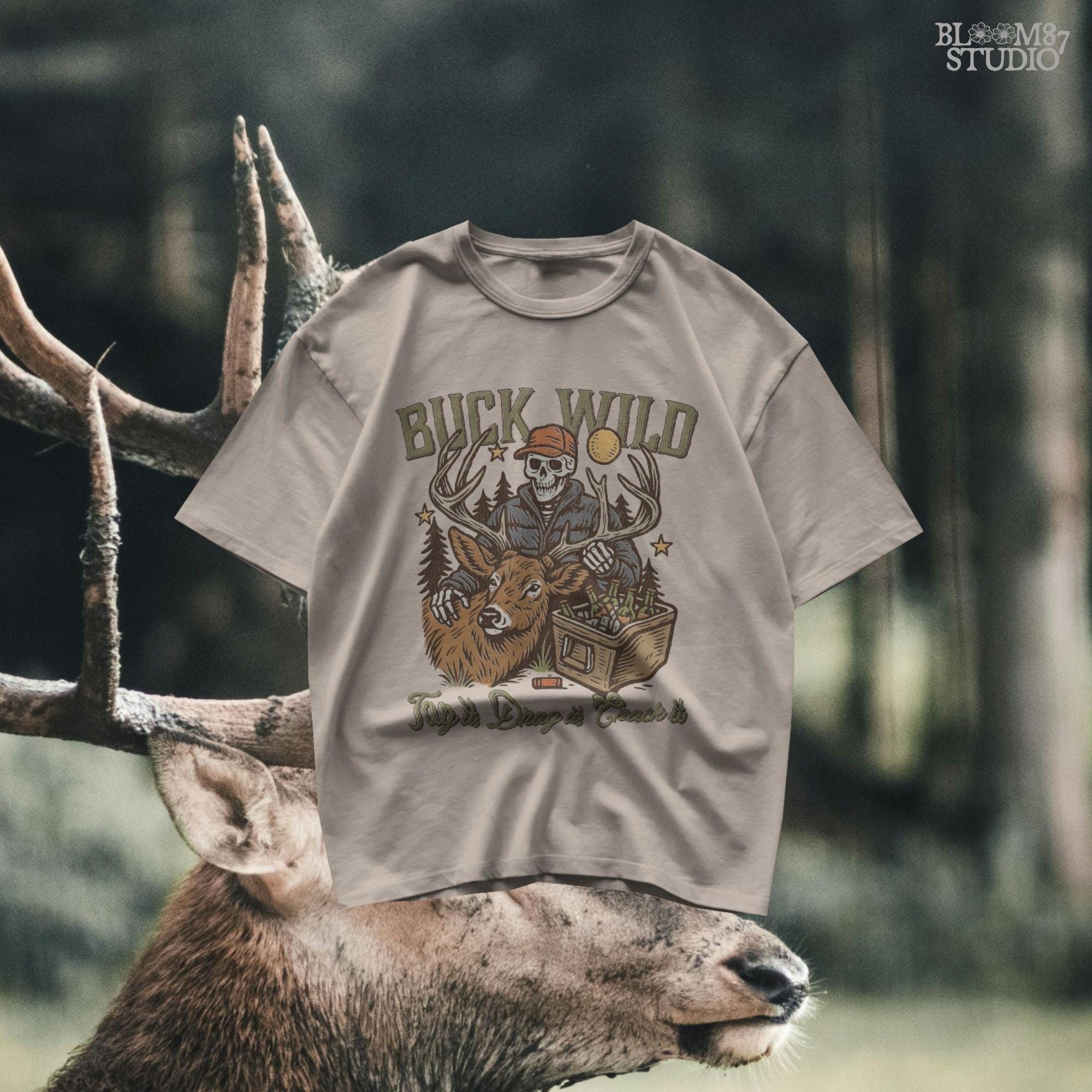 A funny deer hunting illustration with a skeleton hunter holding a buck and cooler of beer under the phrase “Tag it, Drag it, Crack it”.