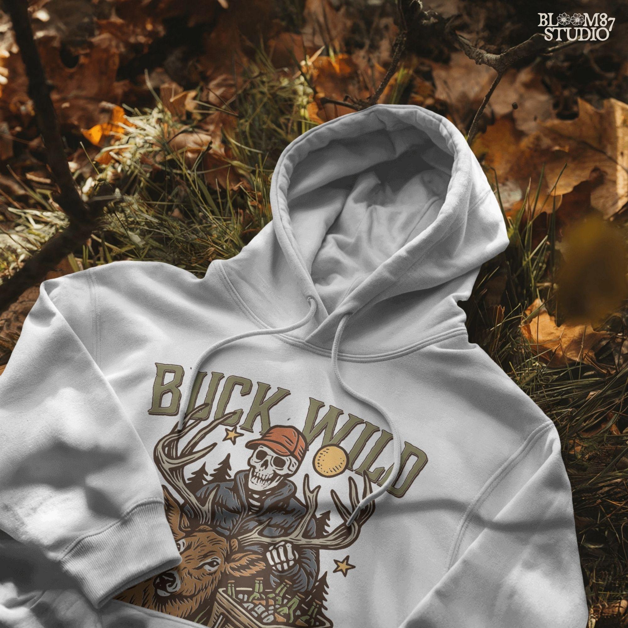 A funny deer hunting illustration with a skeleton hunter holding a buck and cooler of beer under the phrase “Tag it, Drag it, Crack it”.