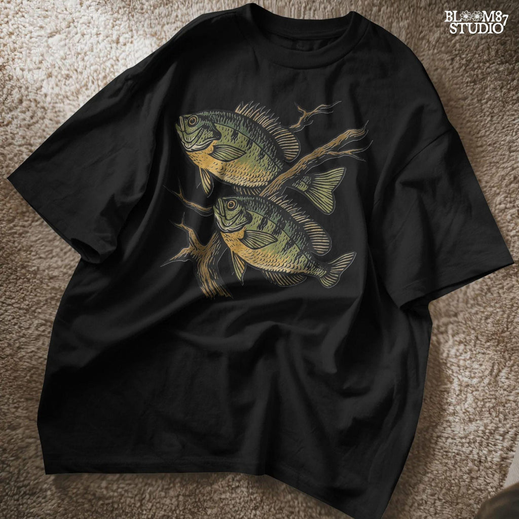 Two vintage-style bluegill fish swimming with underwater branches – realistic rustic PNG for sublimation shirts, signs, and fishing gifts.