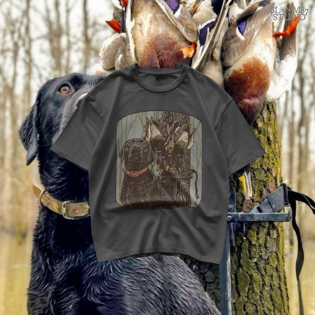 Digital PNG design of a black lab hunting dog with mallard ducks on a strap, ideal for sublimation printing on hunting-themed apparel