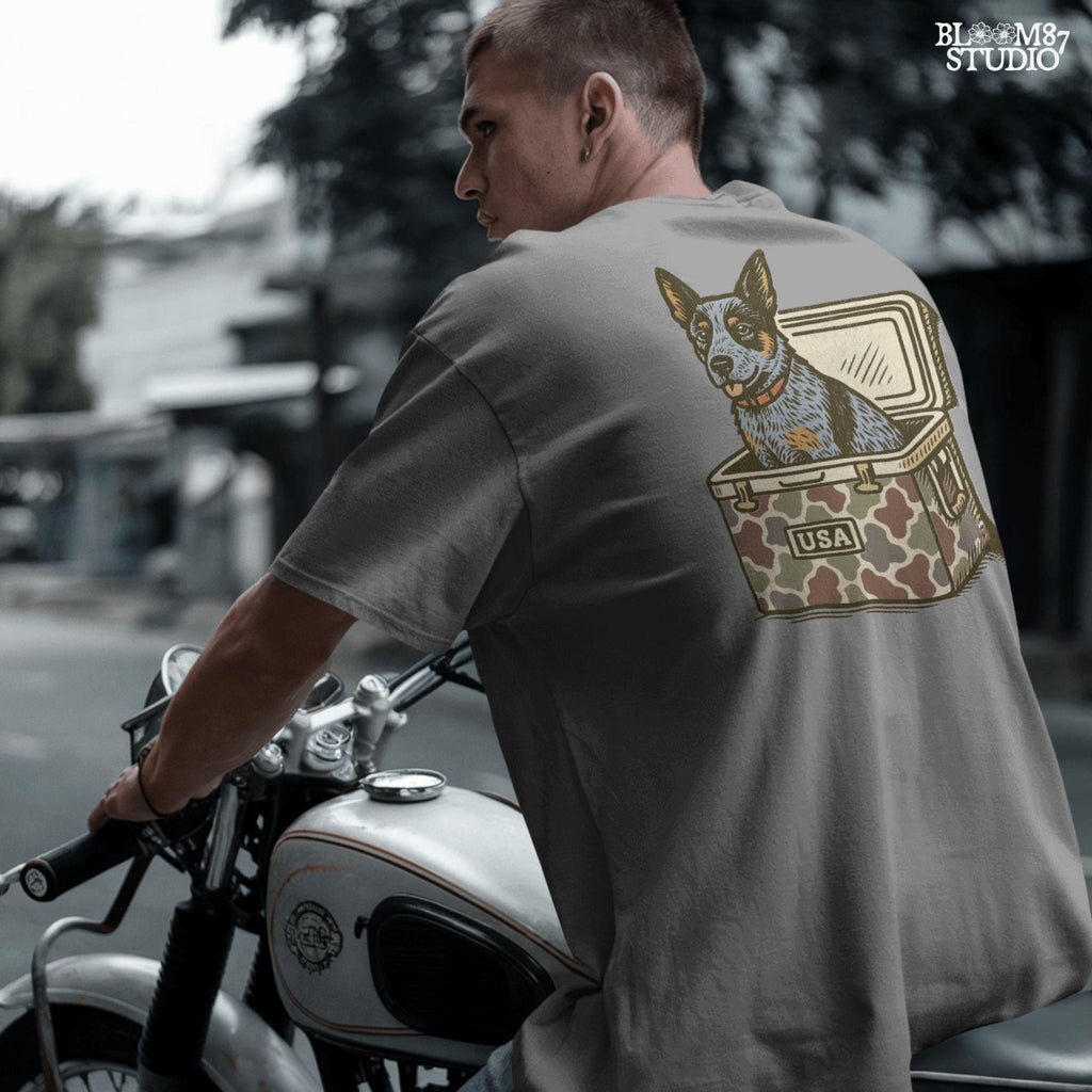 Blue Heeler Australian Cattle Dog sitting in USA camouflage ice chest cooler, patriotic digital PNG for sublimation designs.