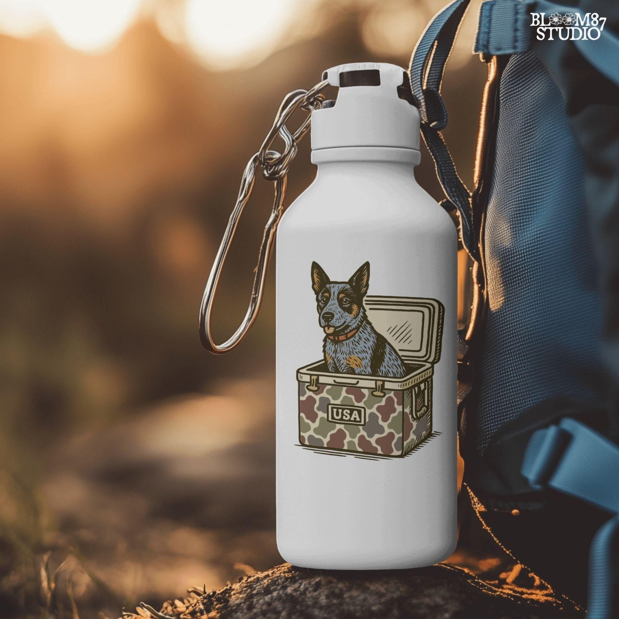 Blue Heeler Australian Cattle Dog sitting in USA camouflage ice chest cooler, patriotic digital PNG for sublimation designs.