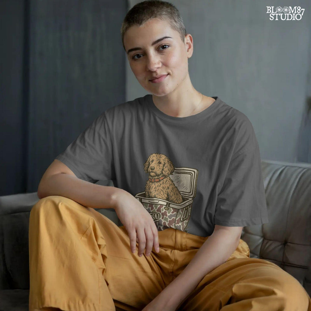 Curly Goldendoodle dog sitting inside a USA camouflage cooler, digital PNG sublimation file for crafting patriotic pet-themed items.