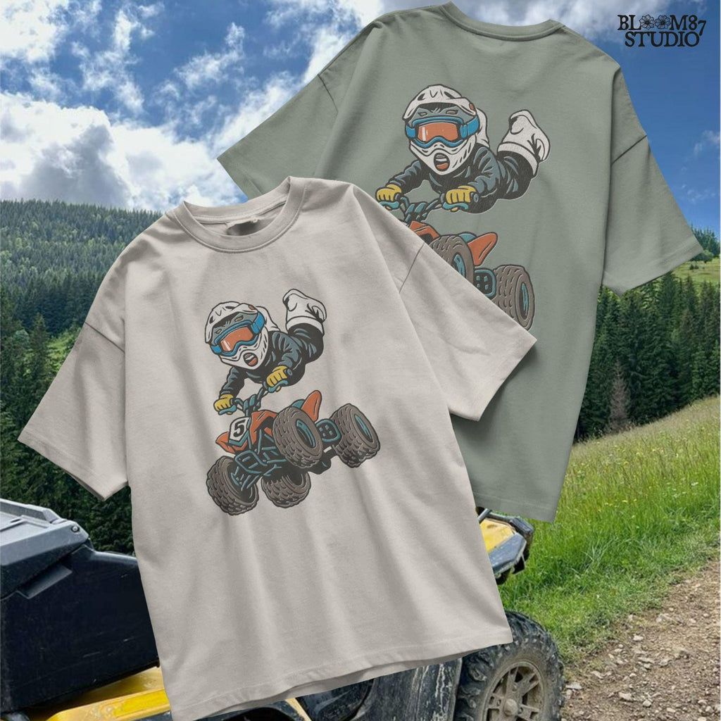 Digital PNG of a boy riding an ATV mid-jump wearing motocross gear and helmet, perfect for kids racing sublimation projects.