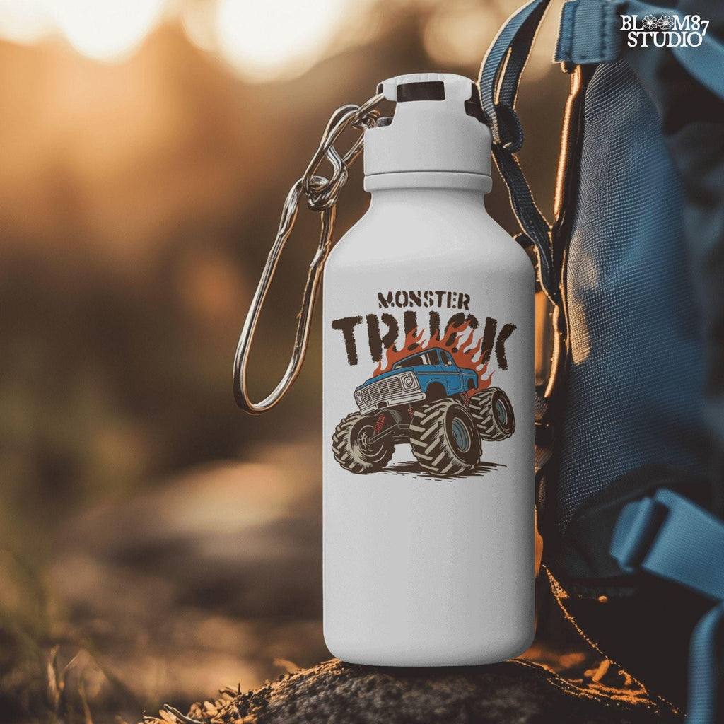 Blue monster truck with huge wheels and orange flames, illustrated in bold lines, ideal for boys birthday sublimation and crafts.