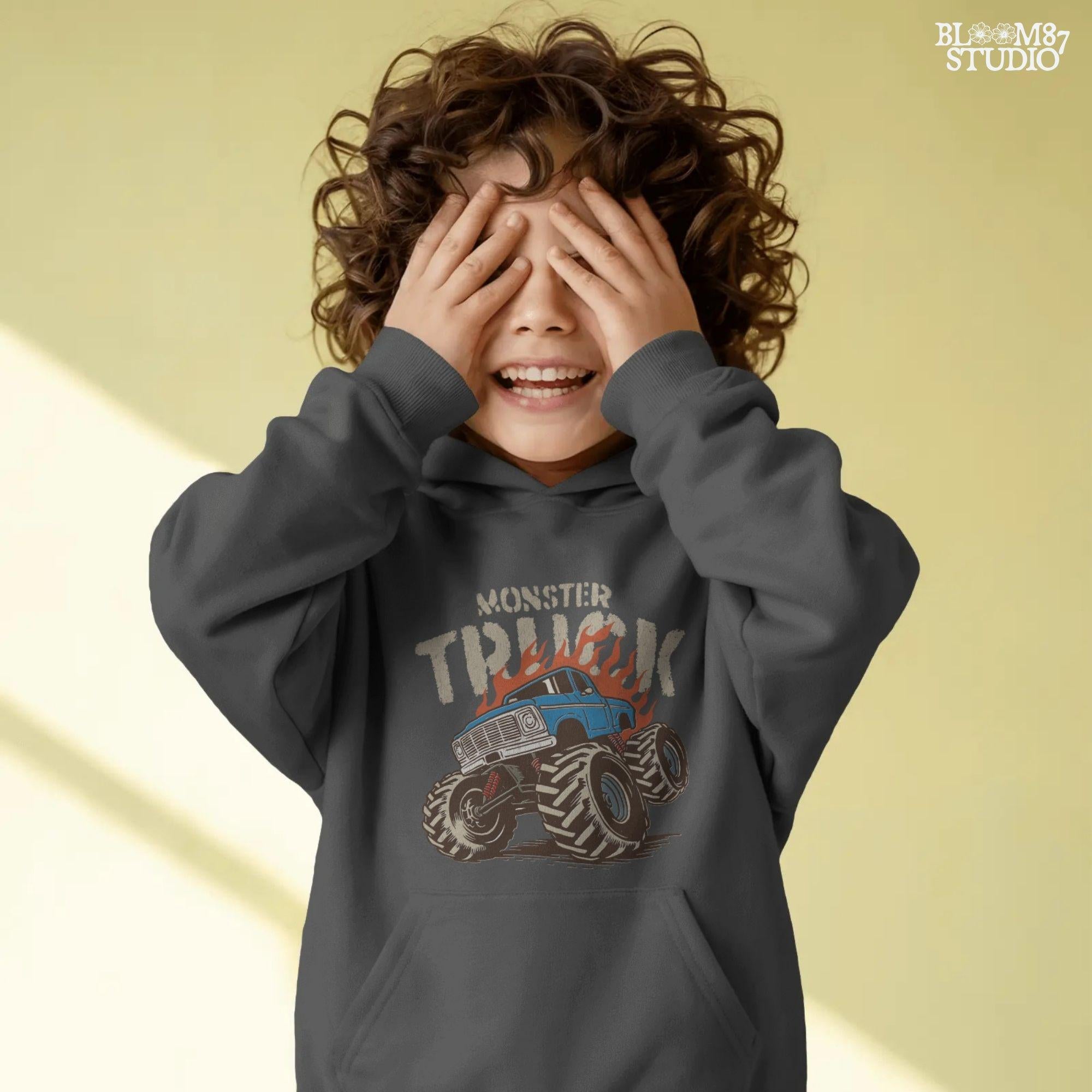 Blue monster truck with huge wheels and orange flames, illustrated in bold lines, ideal for boys birthday sublimation and crafts.